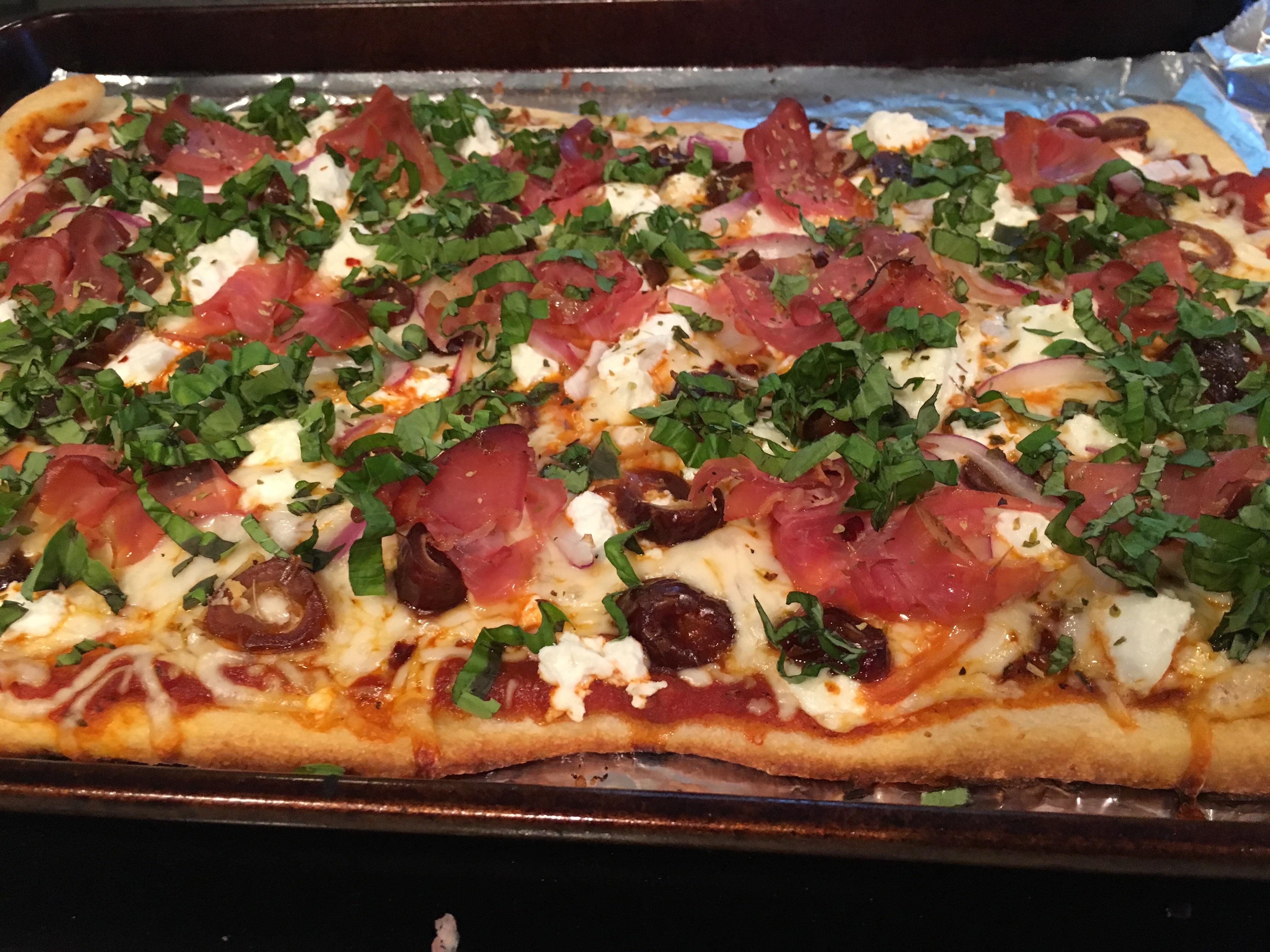 [Homemade] pizza with mozzarella, goat cheese, prosciutto, red onion