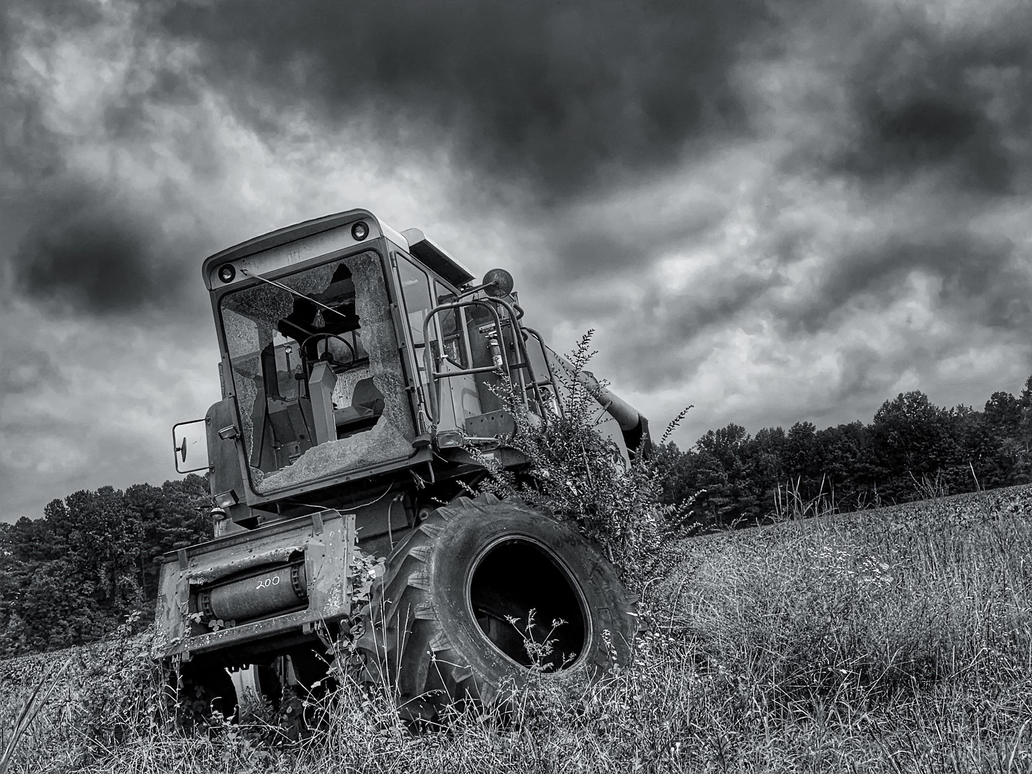 An old harvester at an abandoned farm (Central VA) r/AbandonedPorn