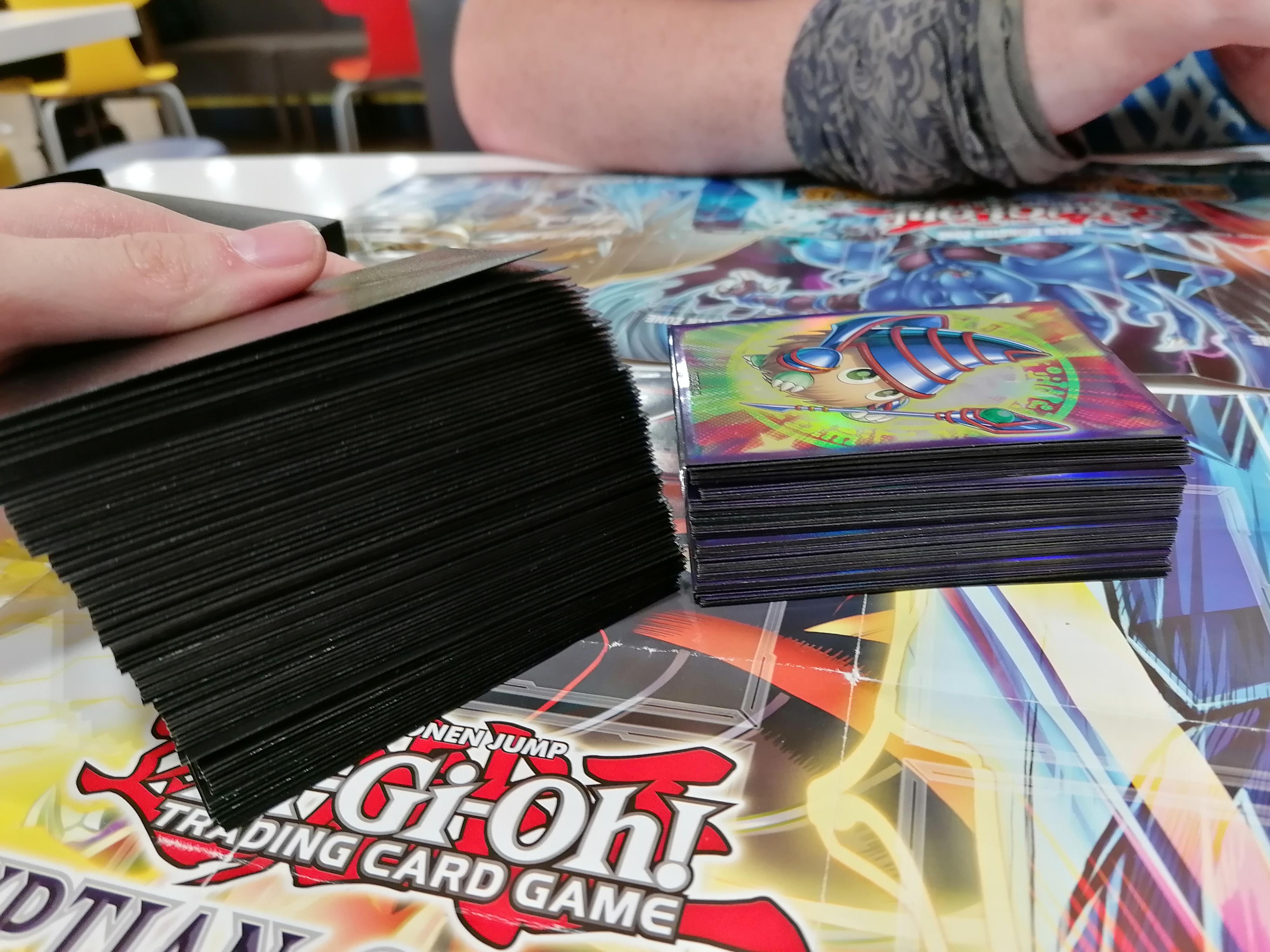 side by side of mine and my friends irl decks. both are 60 cards mine