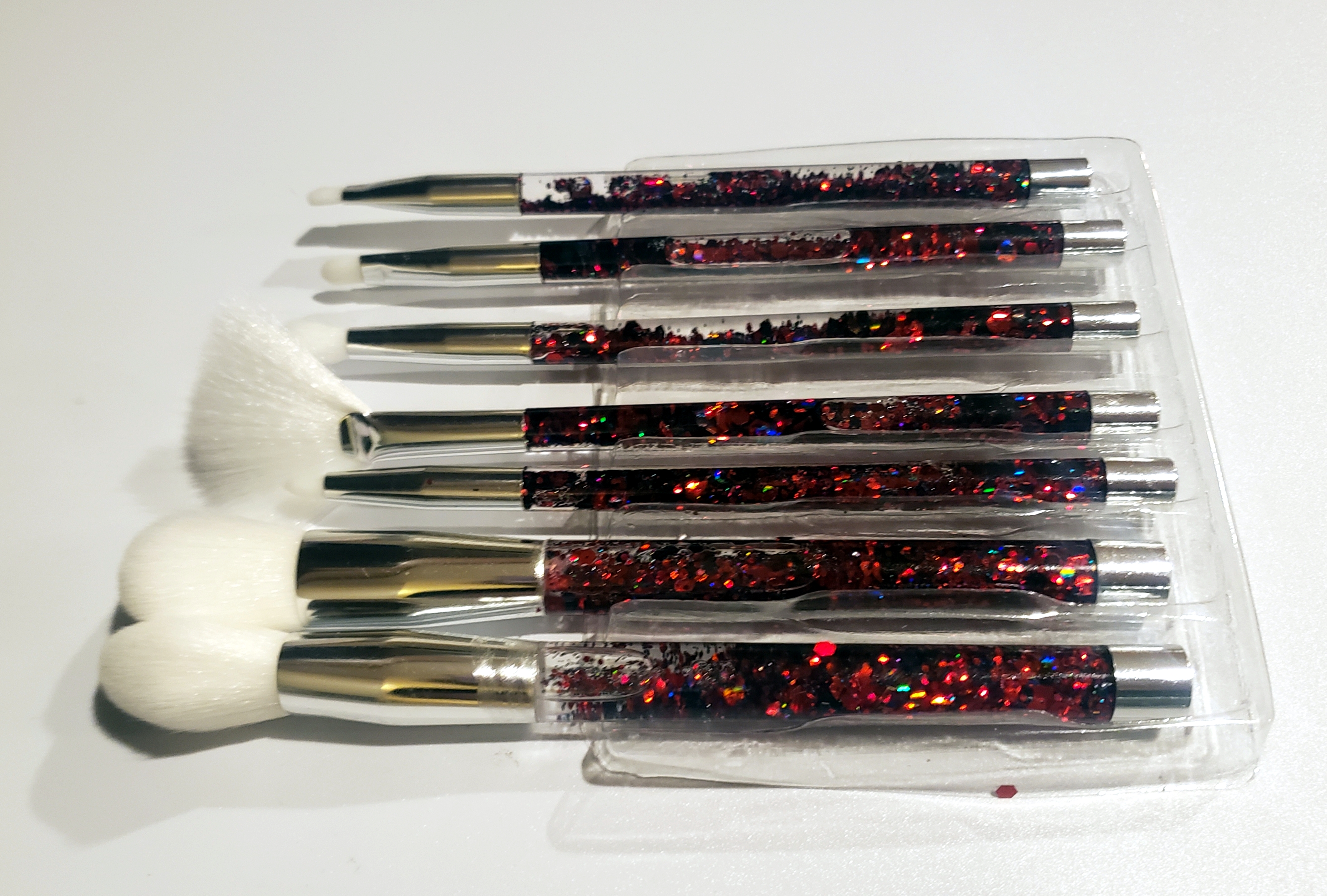 Made these makeup brushes! The glitter in the handles flows back and