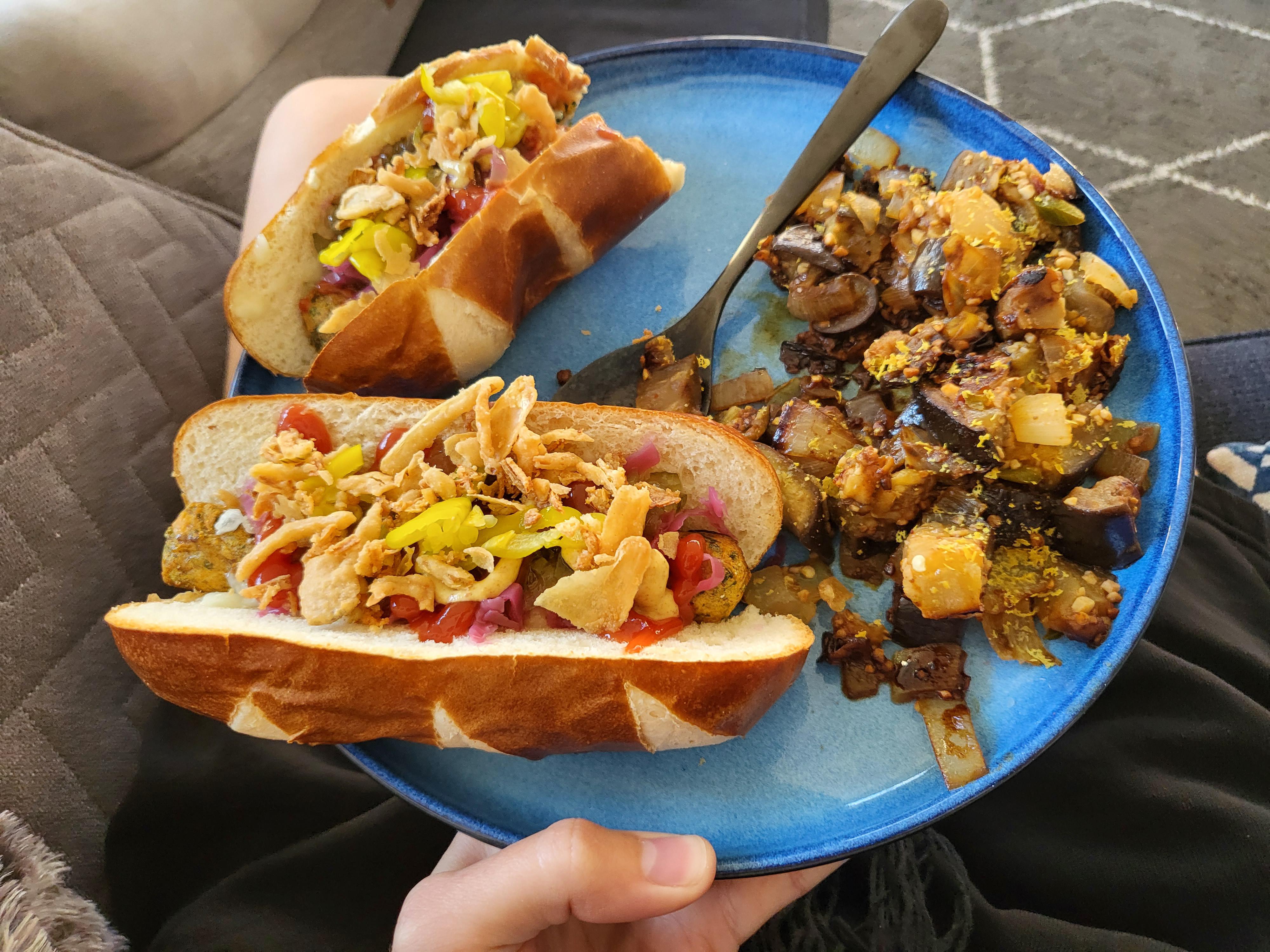 IKEA veggie dogs in pretzel buns, eggplant, onions, and garlic and
