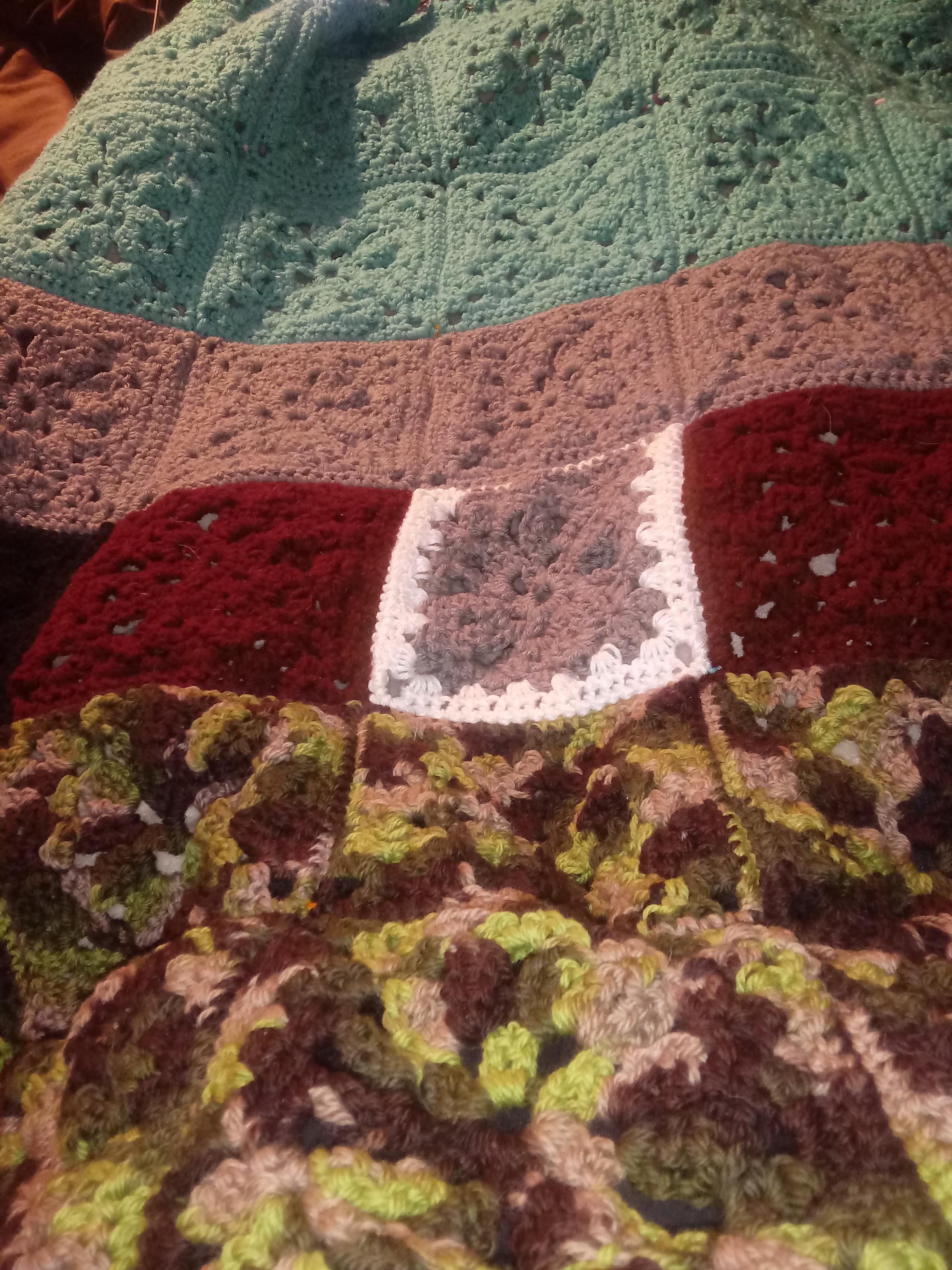 After more than a month and multiple skeins of yarn, my blanket is done