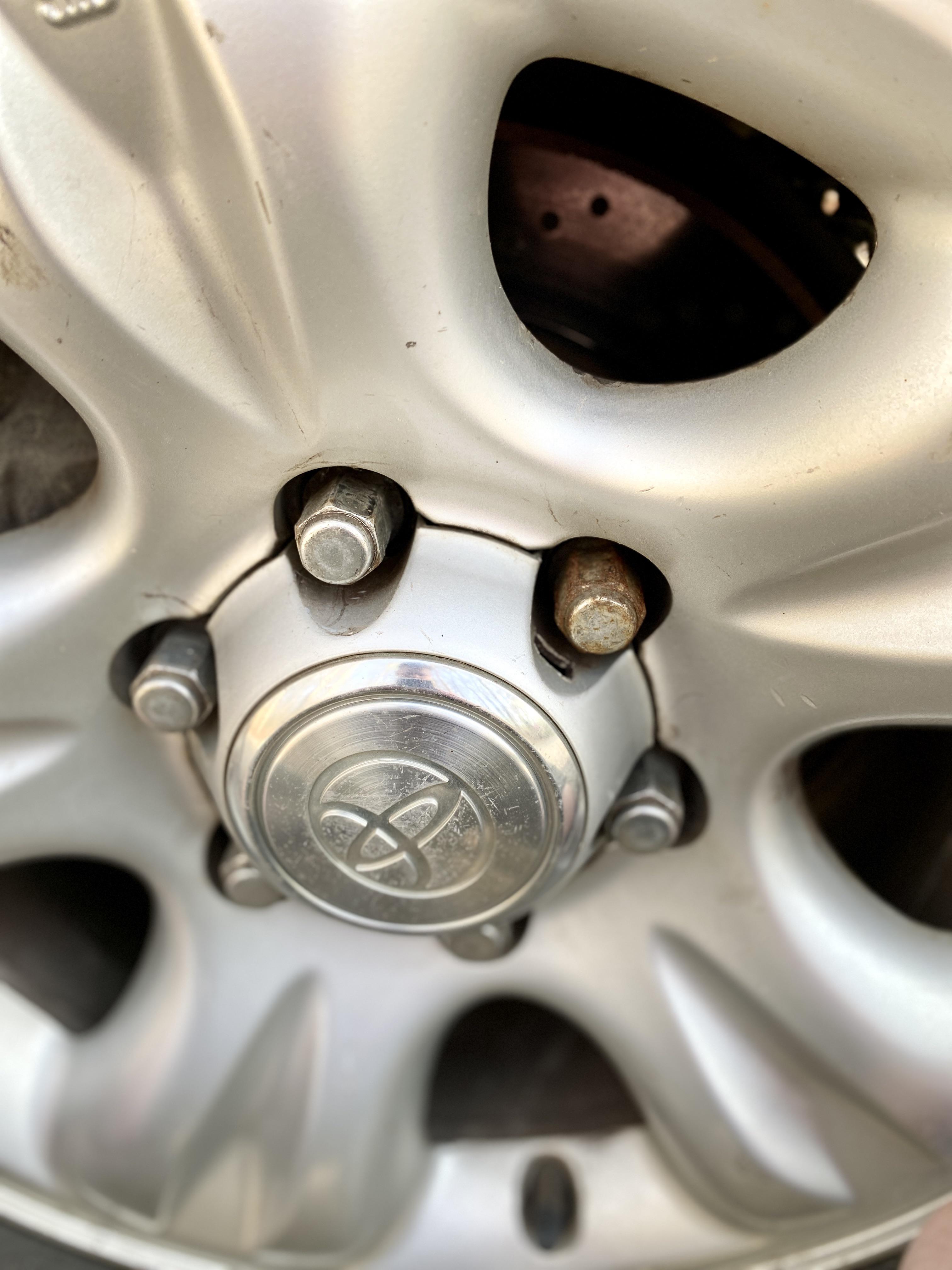 Can you guess which lug nut is from Autozone? Always buy OEM kids.. r