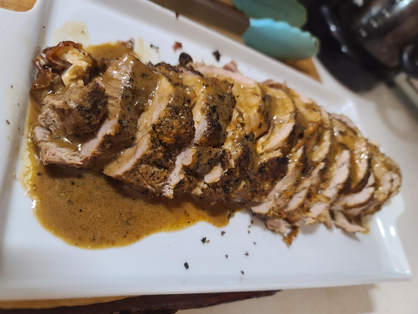Prosciutto and mozzarella stuffed pork tenderloin with a porter cream