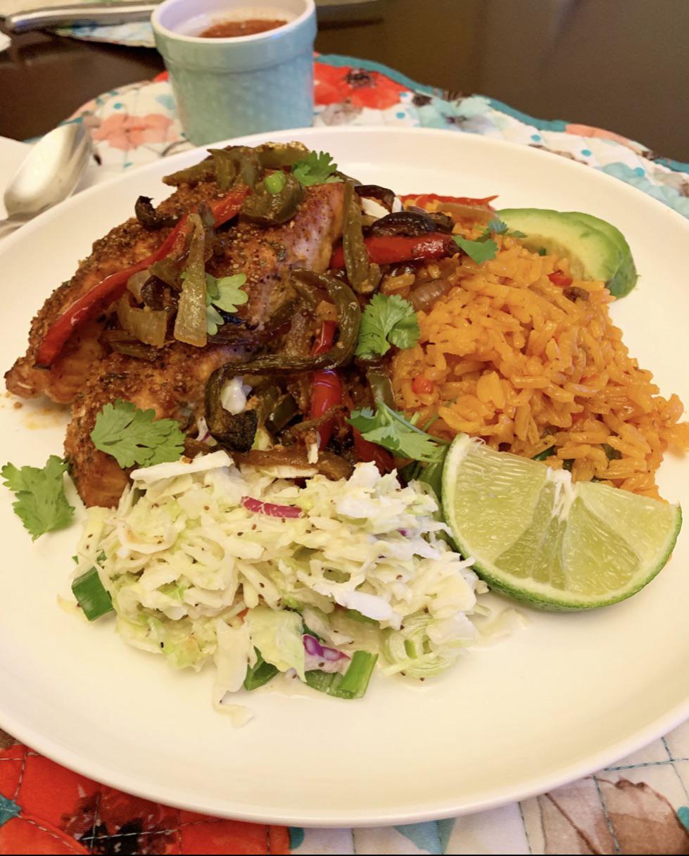 spanish roasted salmon with homemade yellow rice, scallion slaw, and fajita veggies. r