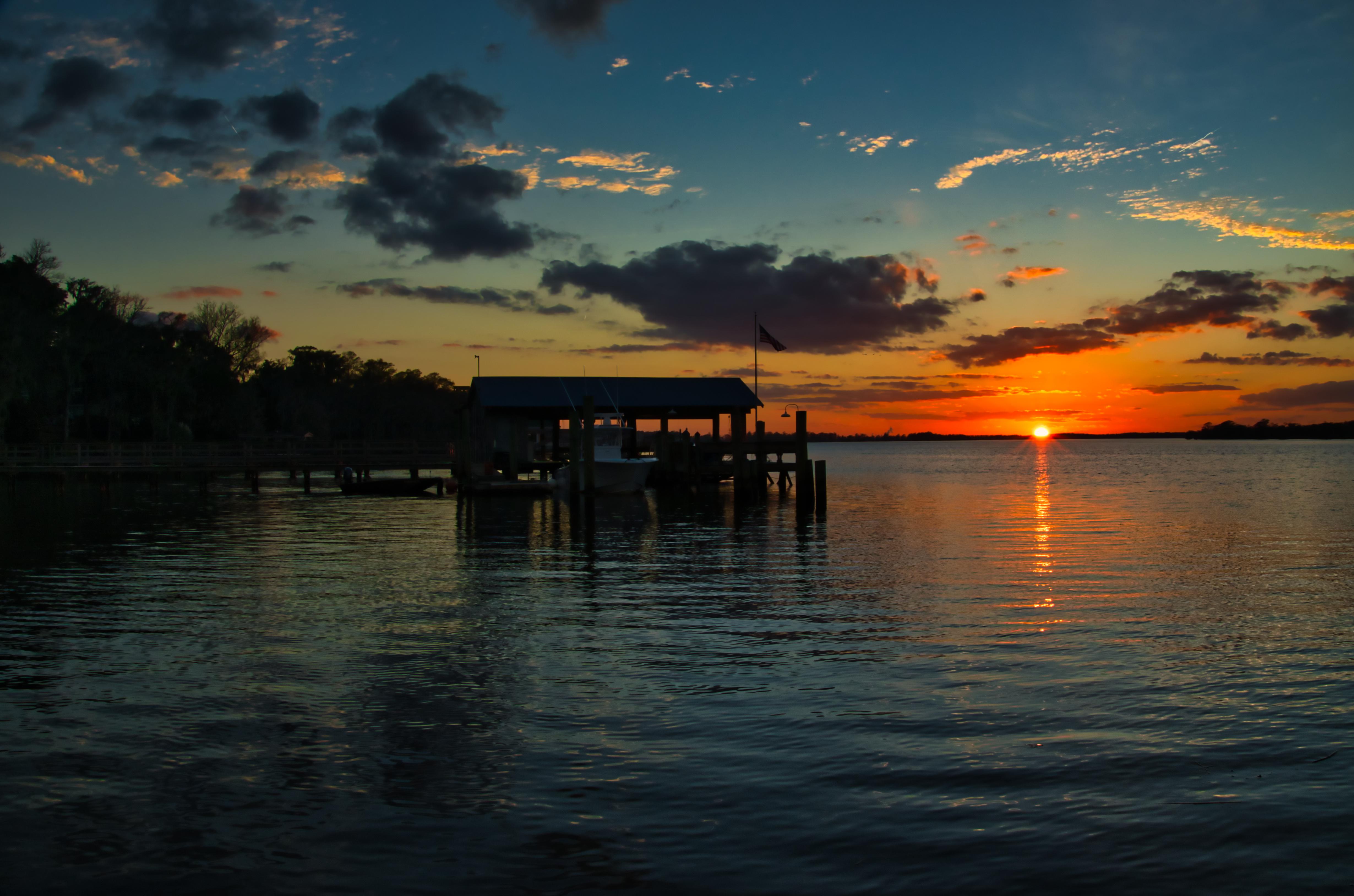 Sun dips it toes in the Waccamaw river this evening at Hagley Landing