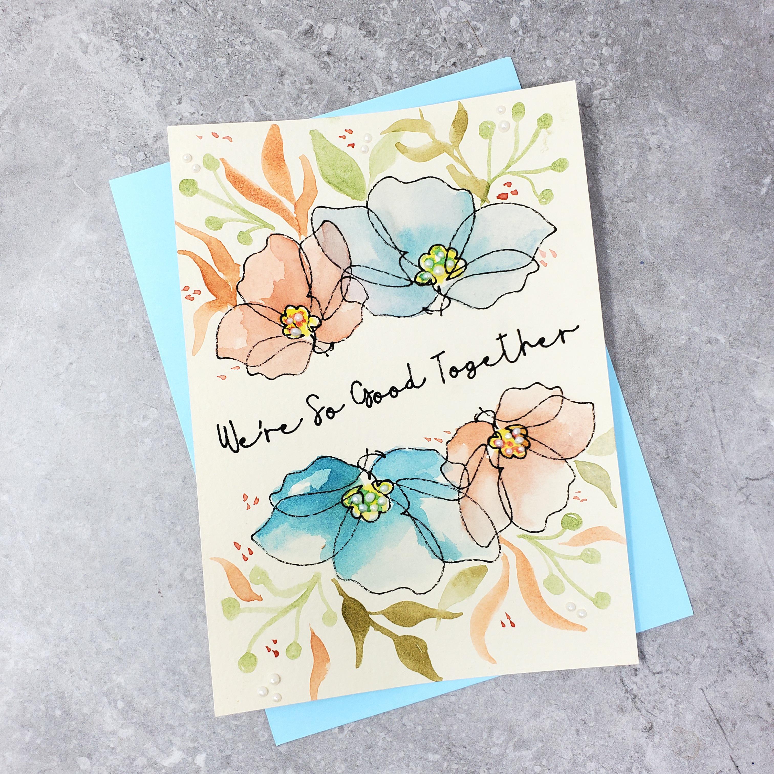 Watercolor on textured cream cardstock. The outline of the floral image and sentiment were drawn