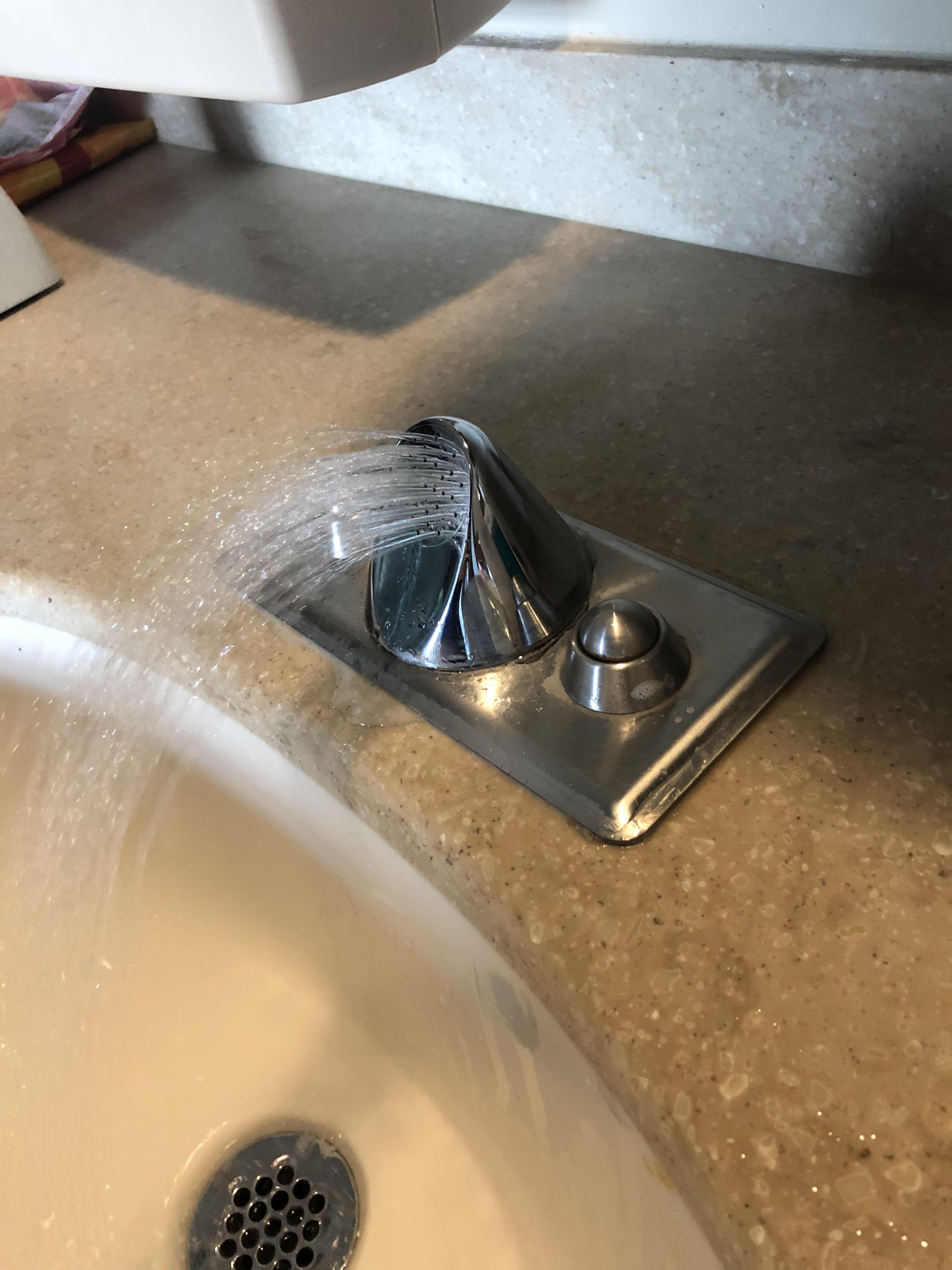 This faucet with a spigot that shoots water in an arc into the sink r