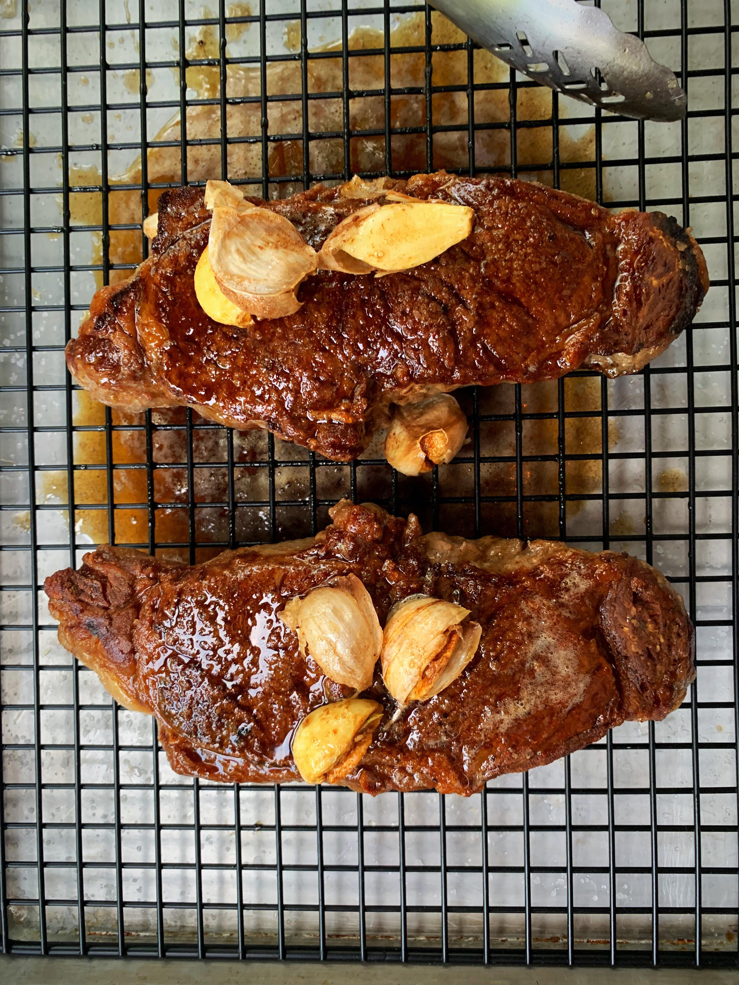 Garlic butter basted strip steak r/tonightsdinner