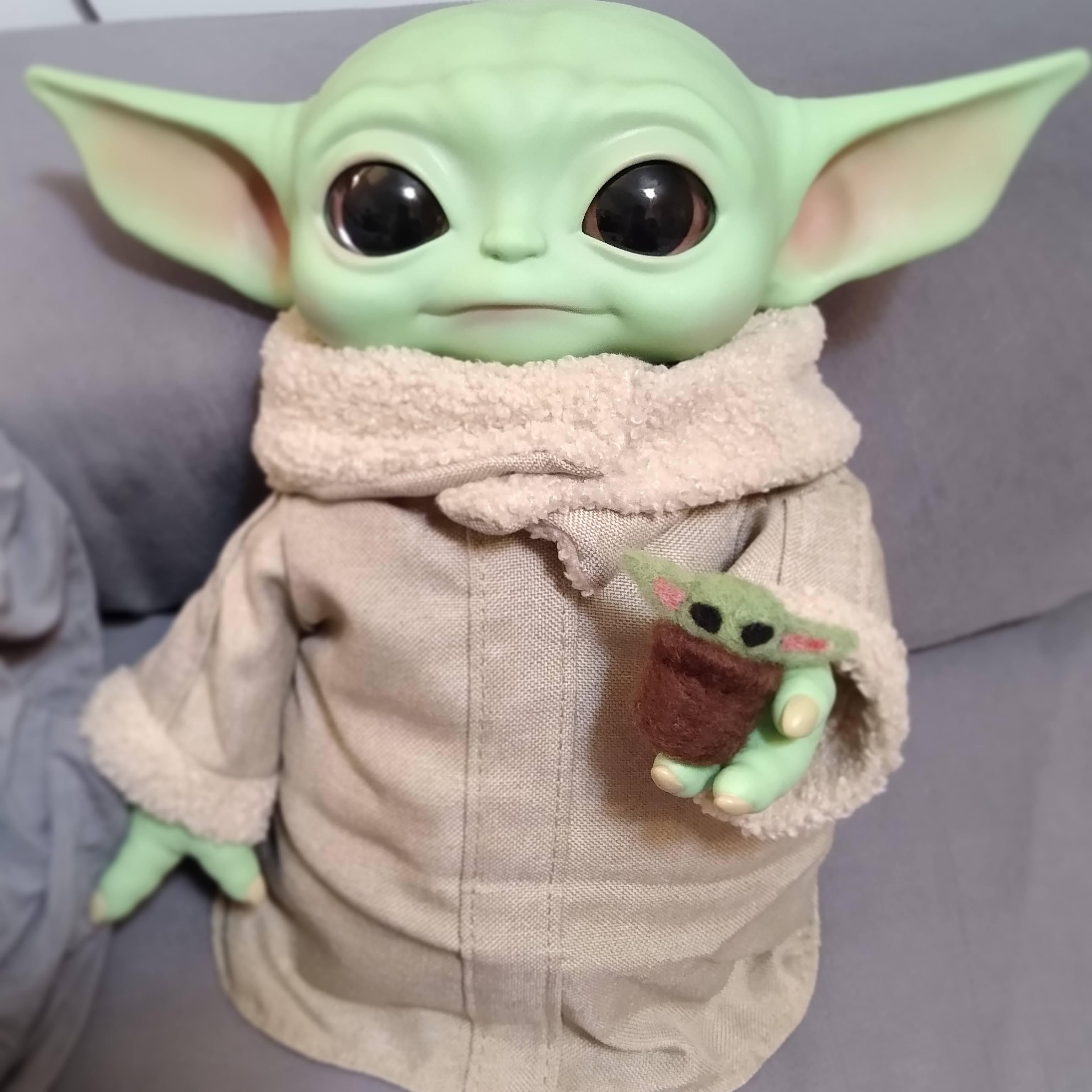 My Baby Yoda holding his own Baby Yoda r/BabyYoda