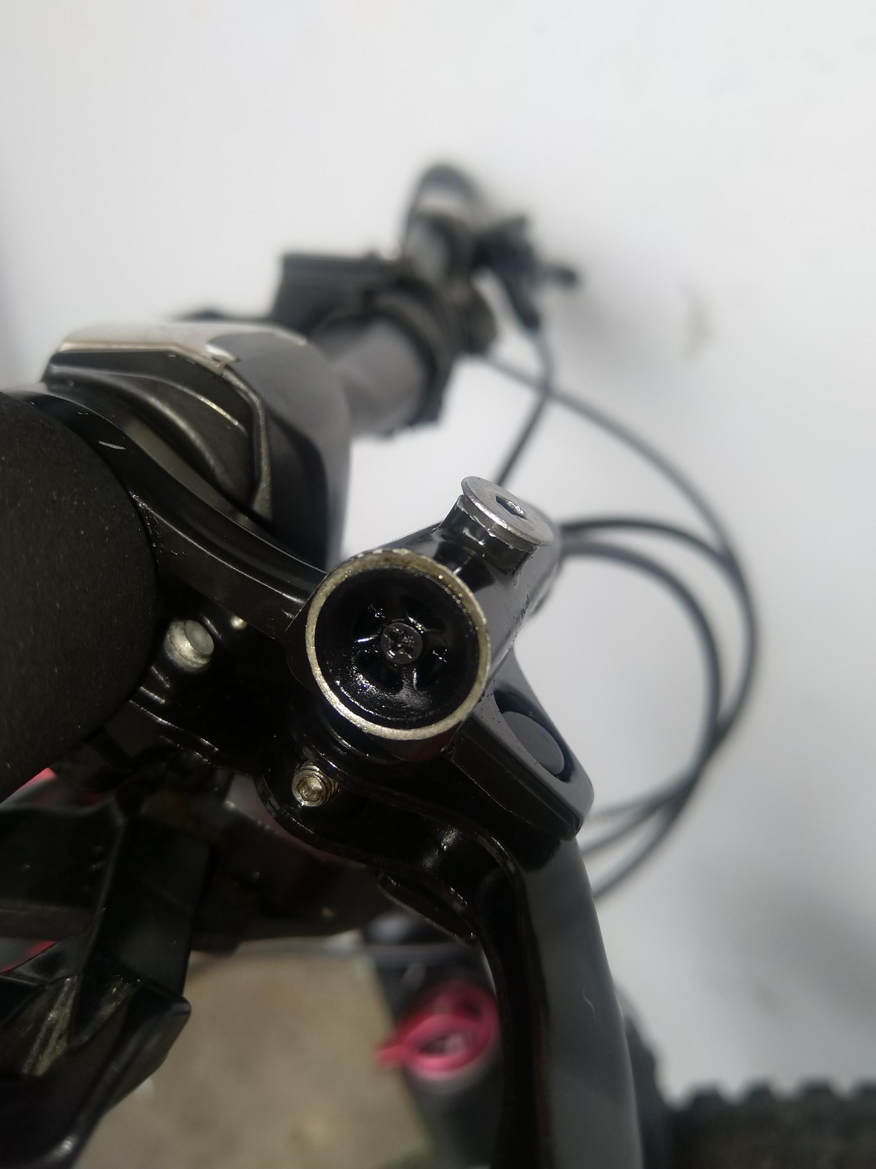 What does this hole do in Shimano MT200 hydraulic brakes? Yes, I messed