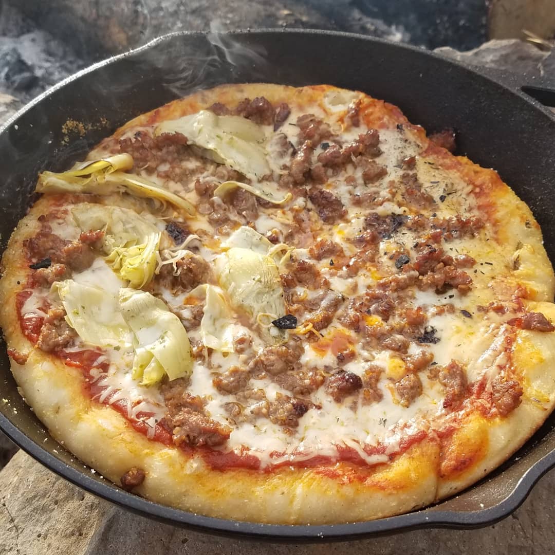 Used my cast iron skillet for the first time to make a campfire pizza