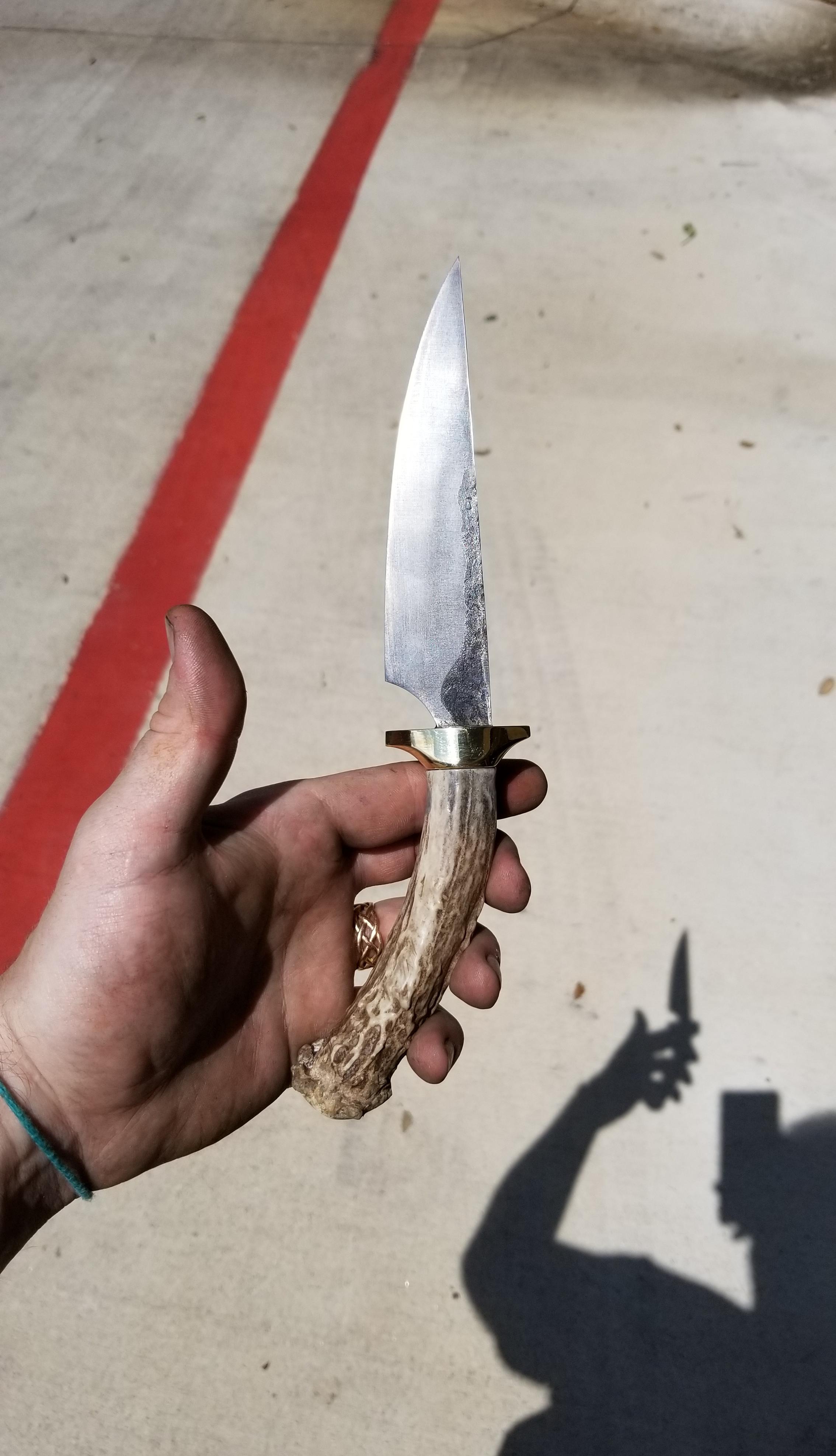 1095 knife, brass guard, and stag antler handle. r/Bladesmith