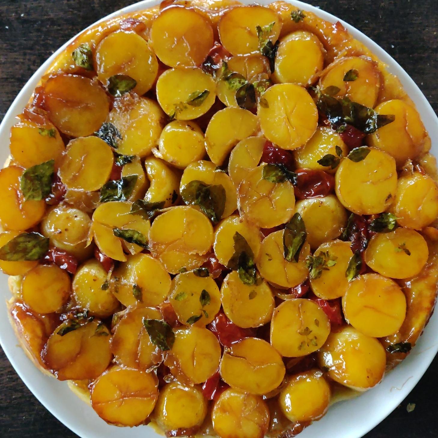 Potato tarte tatin, with goat cheese and ovenroasted cherry tomato's