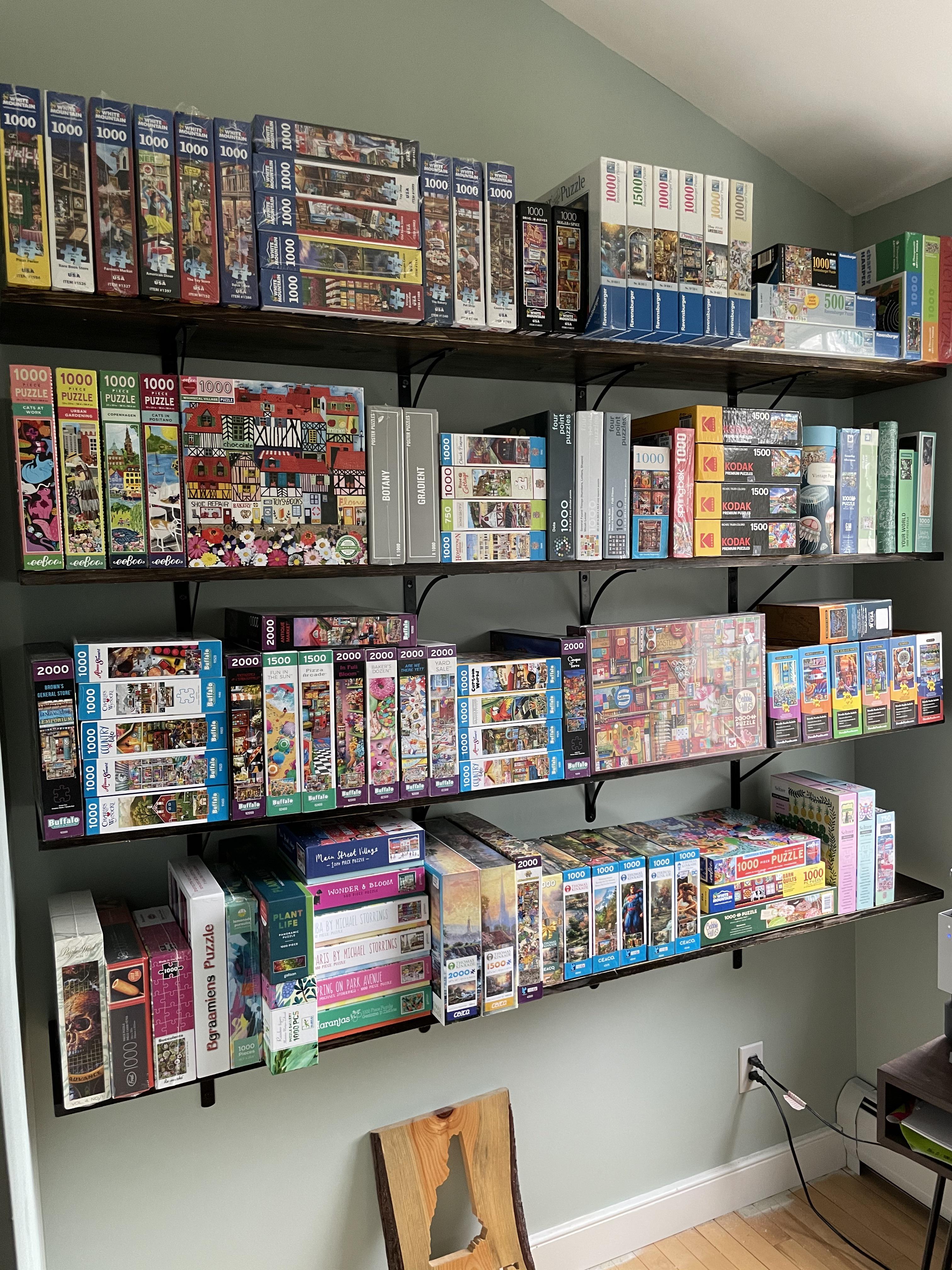 My puzzle shelves look like a store r/Jigsawpuzzles