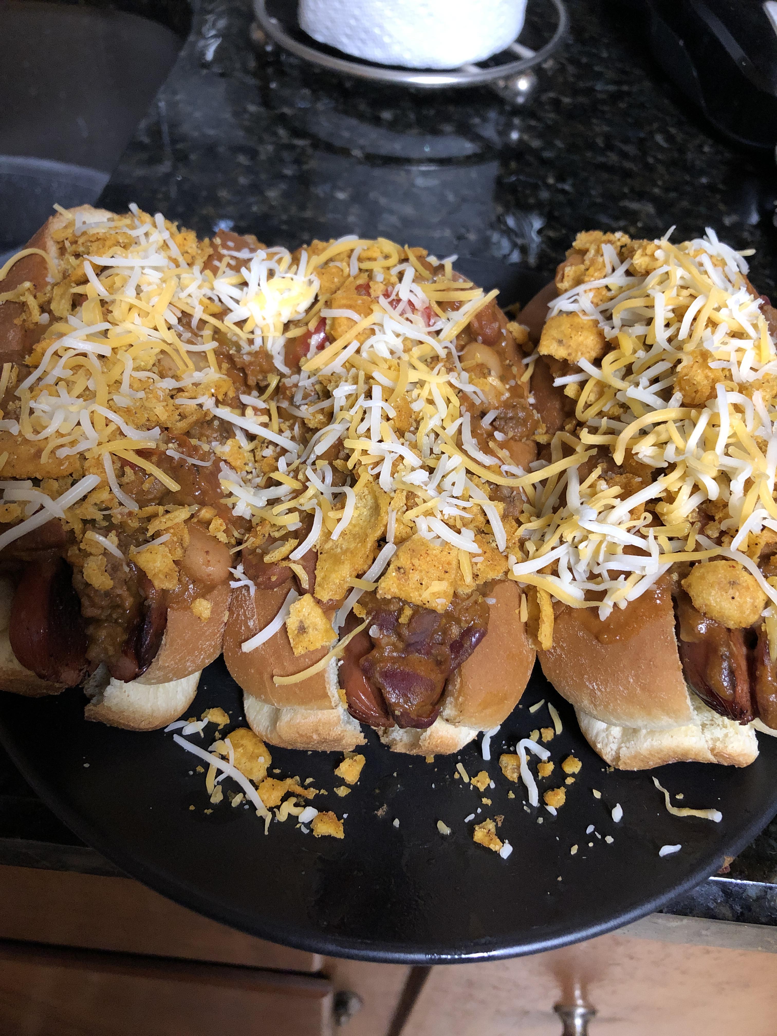 (Homemade) butter fried dogs topped with chili, cheese, and crushed