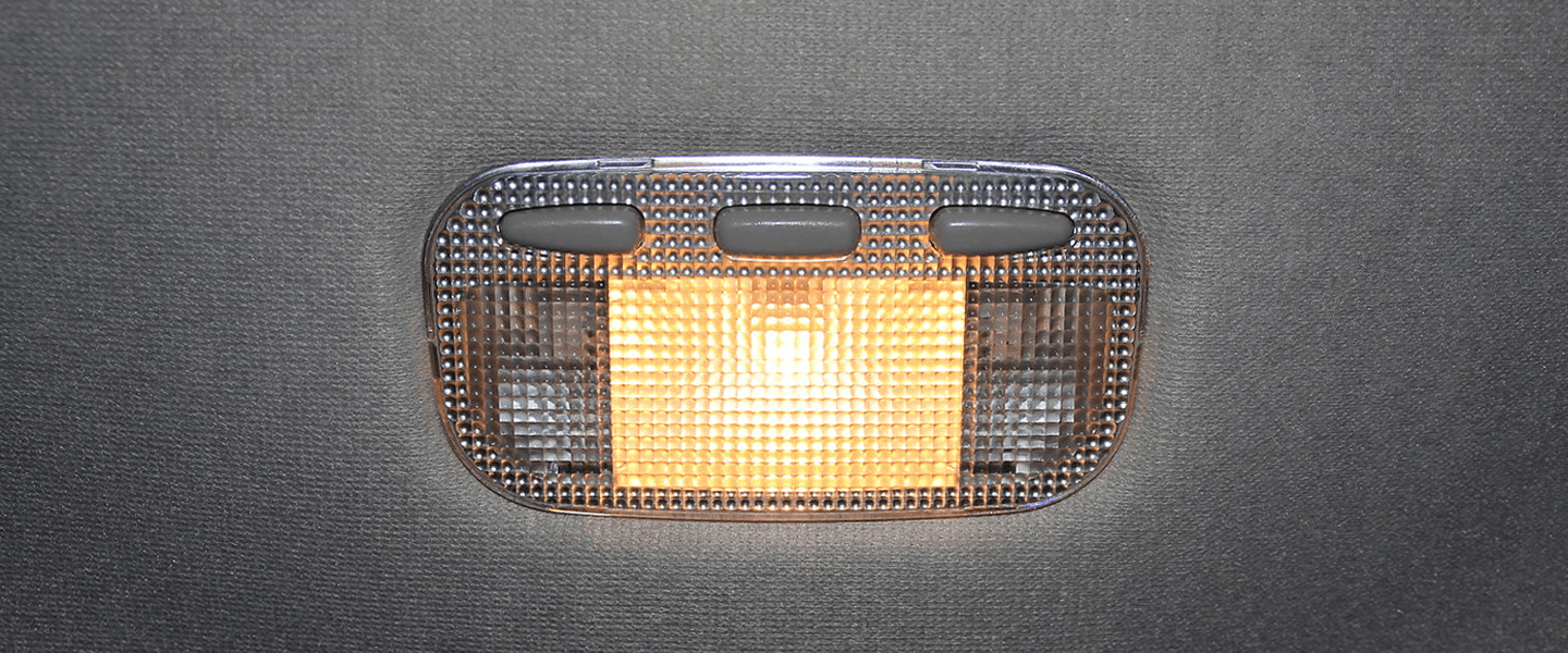 Turning on the dome light in the car on a road trip at night time as a