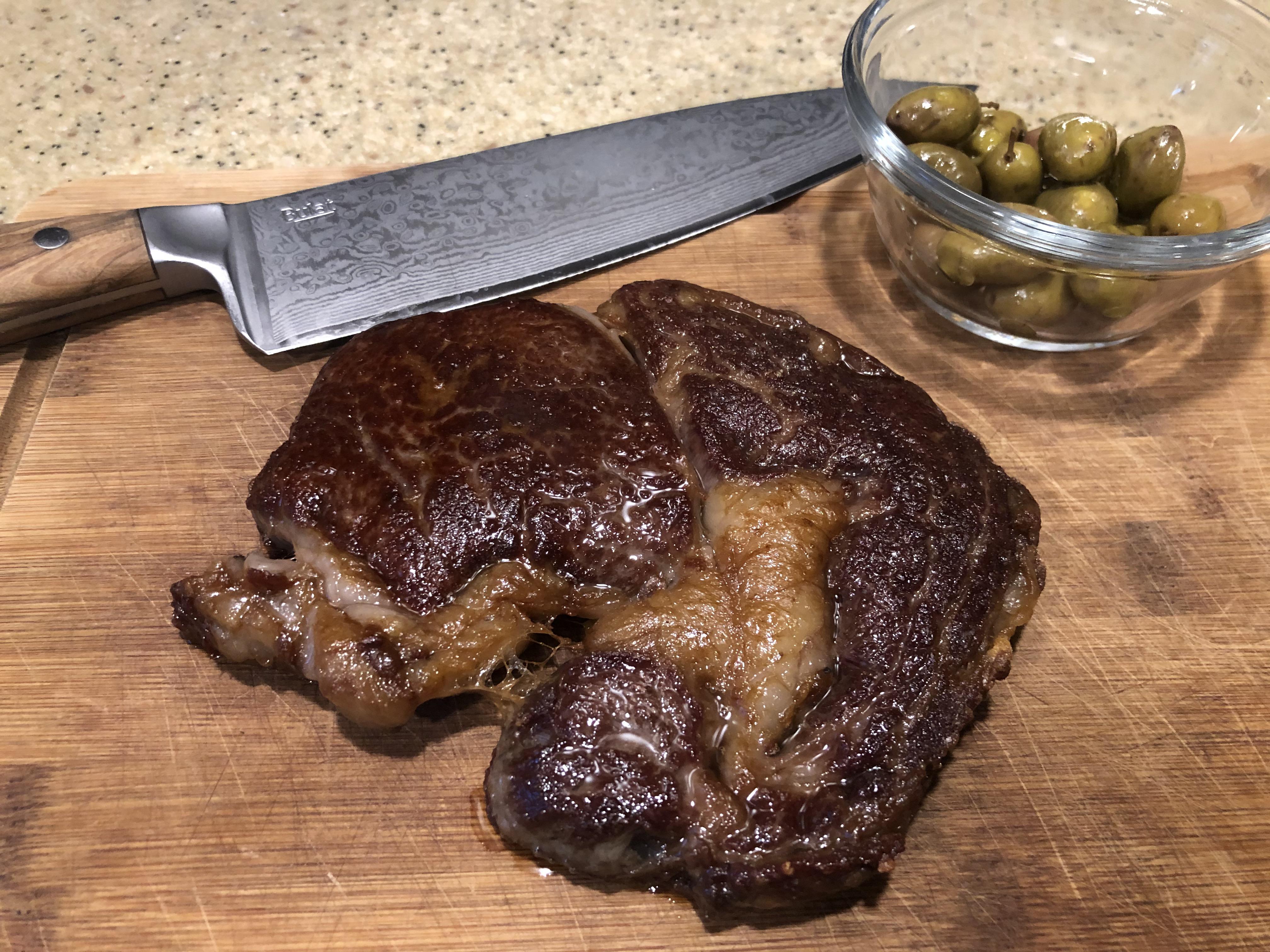 Crusty ribeye panfried in camel fat r/steak