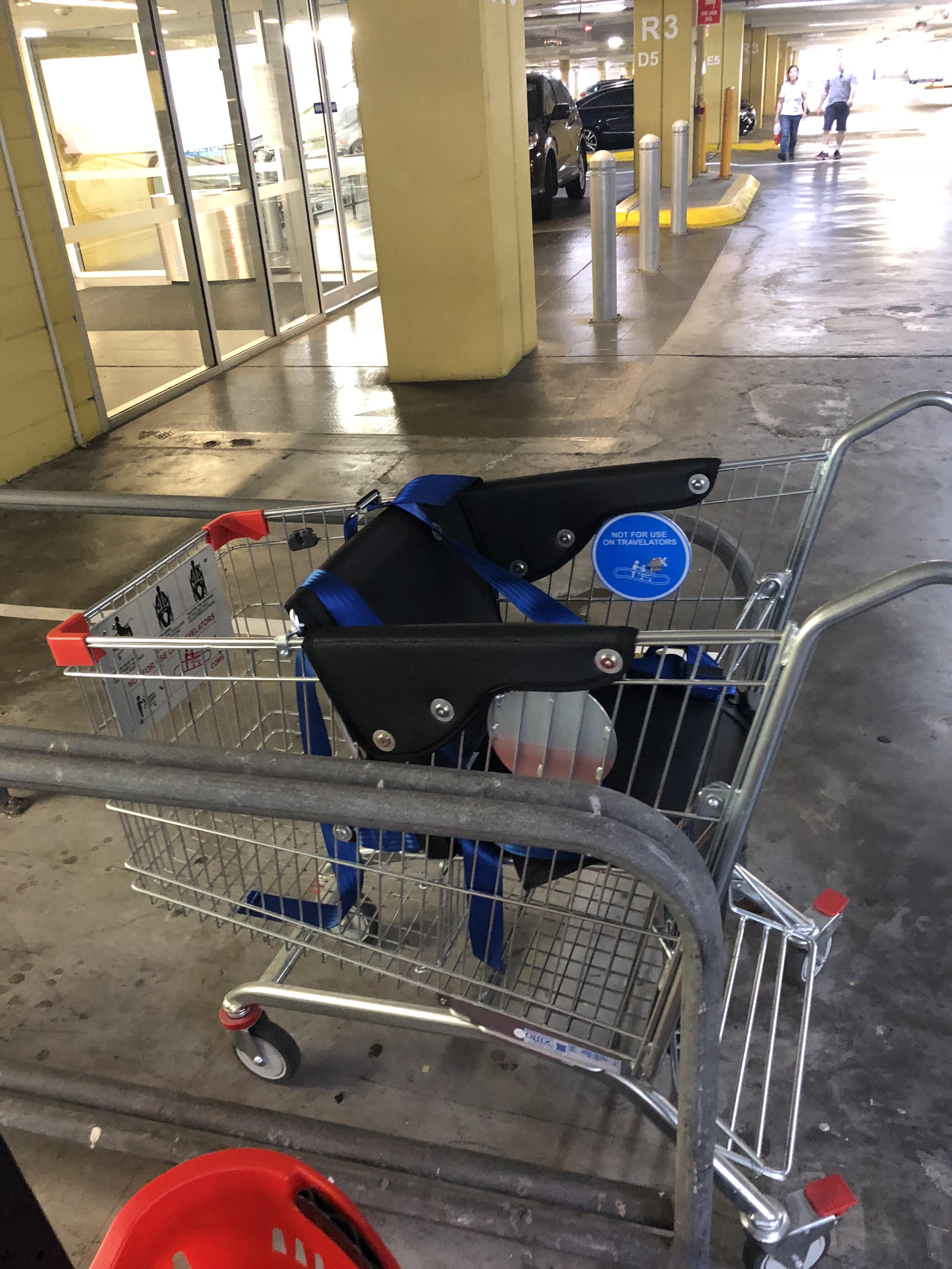 Shopping cart with a seat for an adult... never seen it before. r
