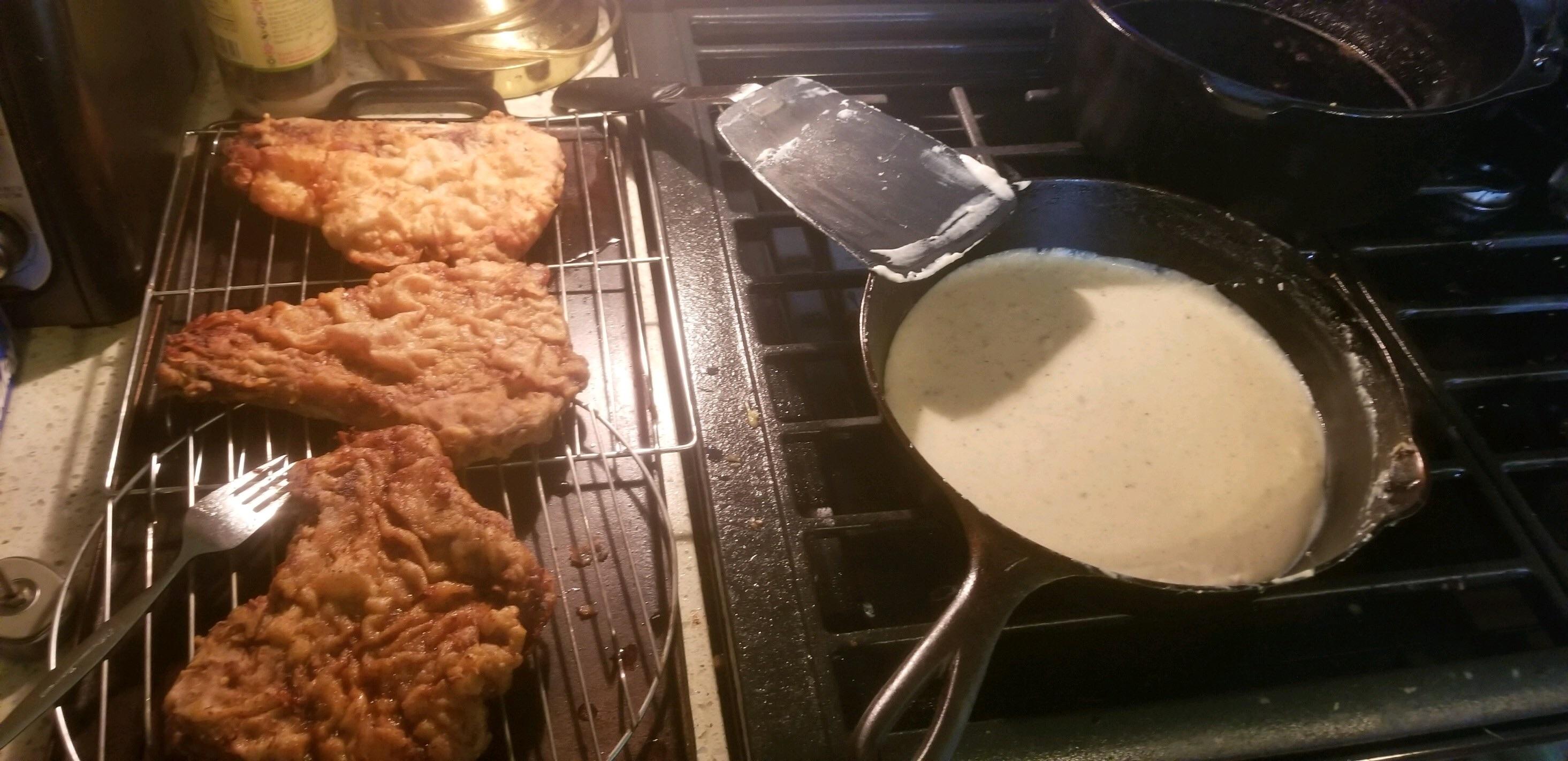 Chicken Fried Steaks in my great grandmothers Dutch oven and gravy in