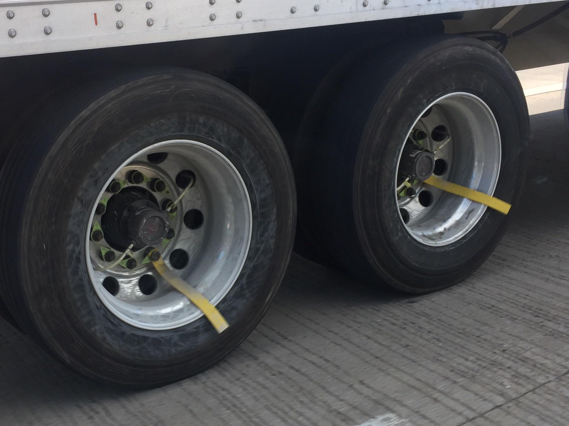 What are these stick things on semitrailer wheels? r/whatisthisthing