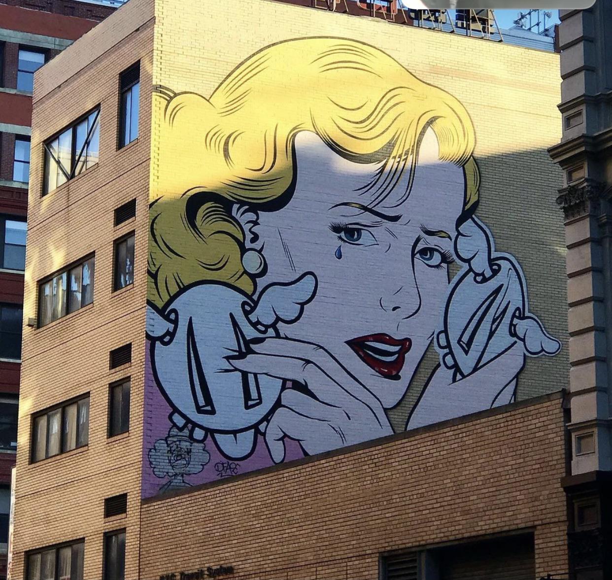 Mural in New York City. I can tell what she’s holding. Any ideas? r