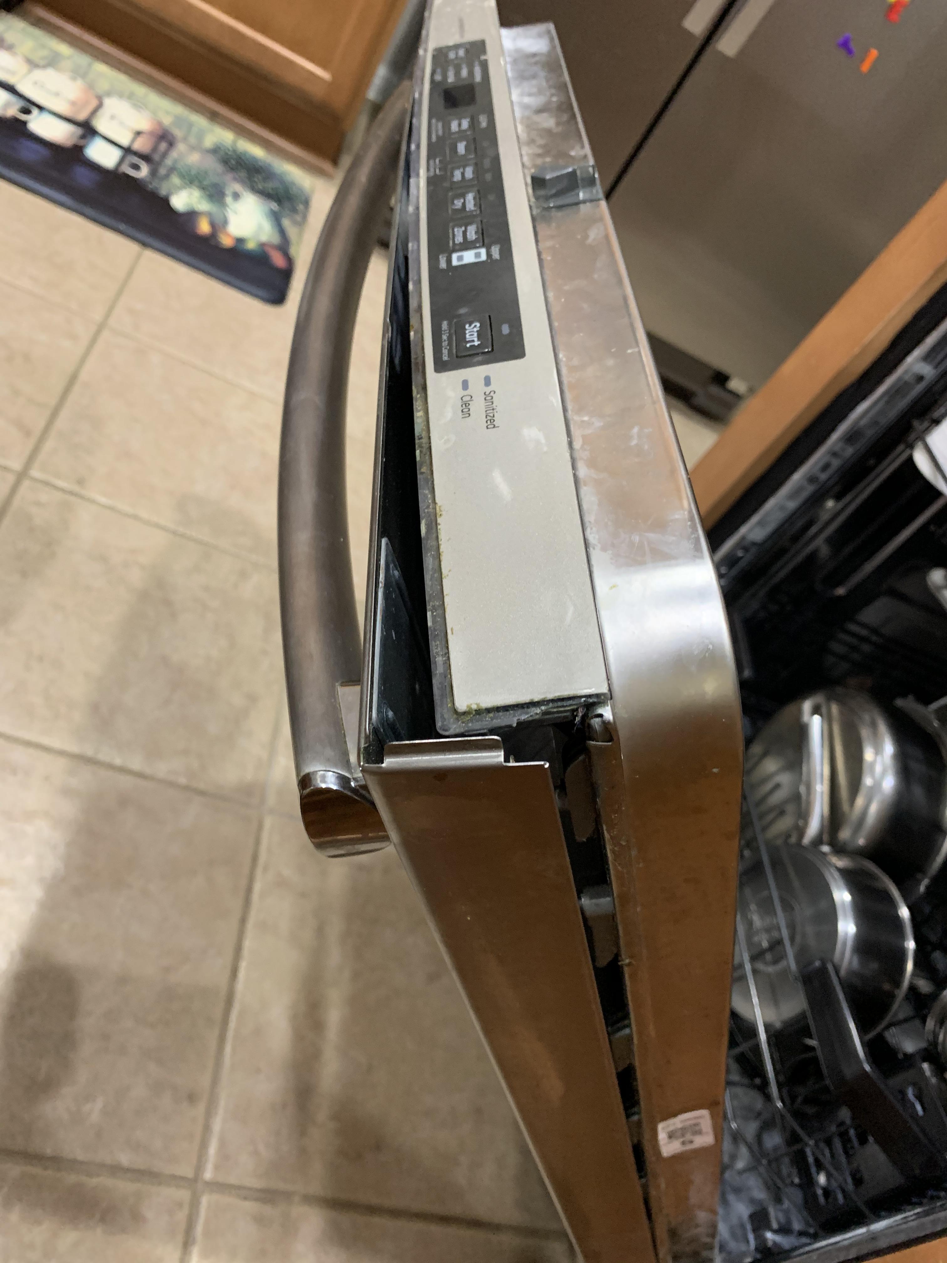 How to fix dishwasher door ? Panel is falling apart and would like fix