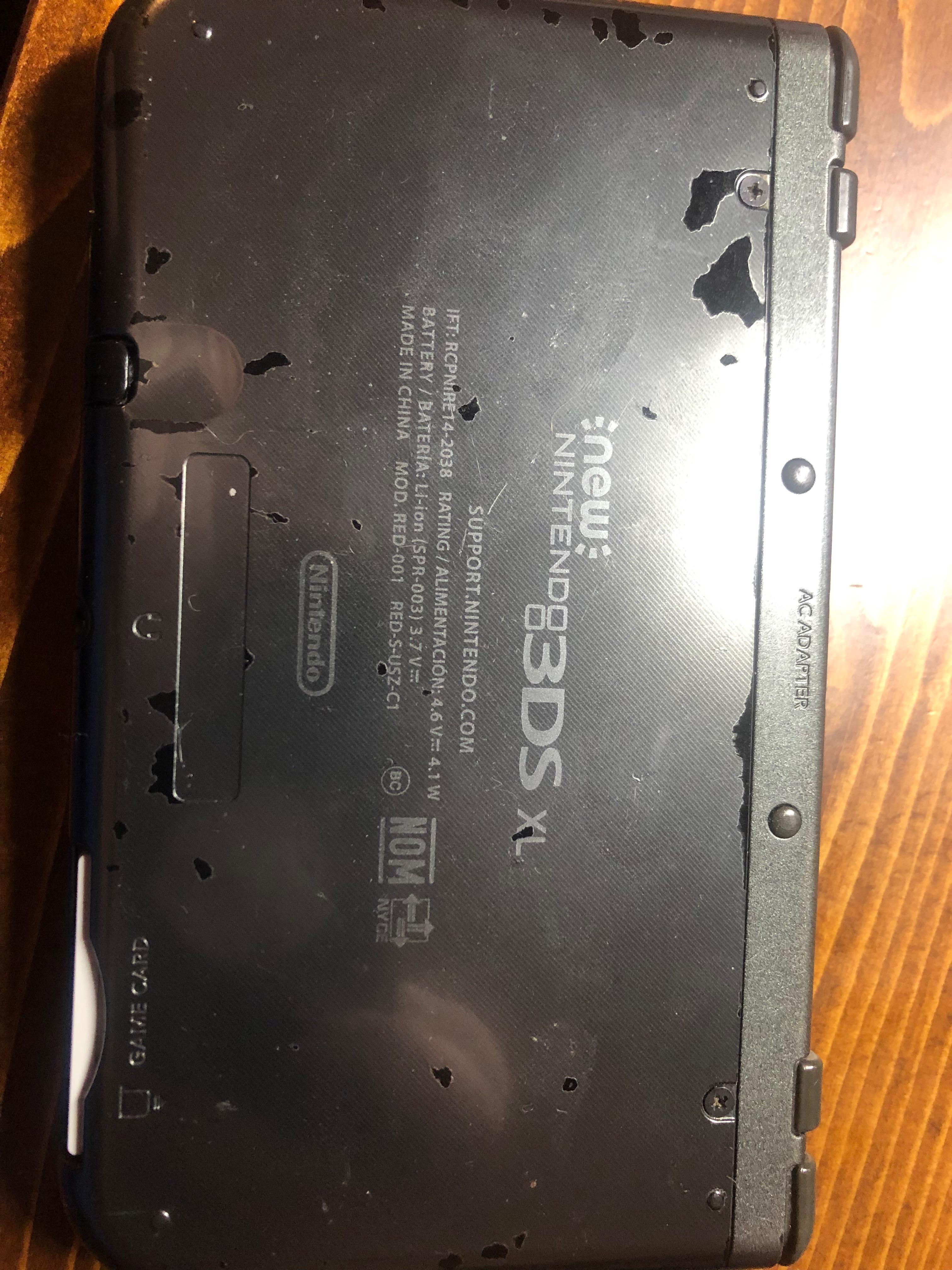 The bottom of my New 3DS XL looks like this now, like paint coming off or something like that