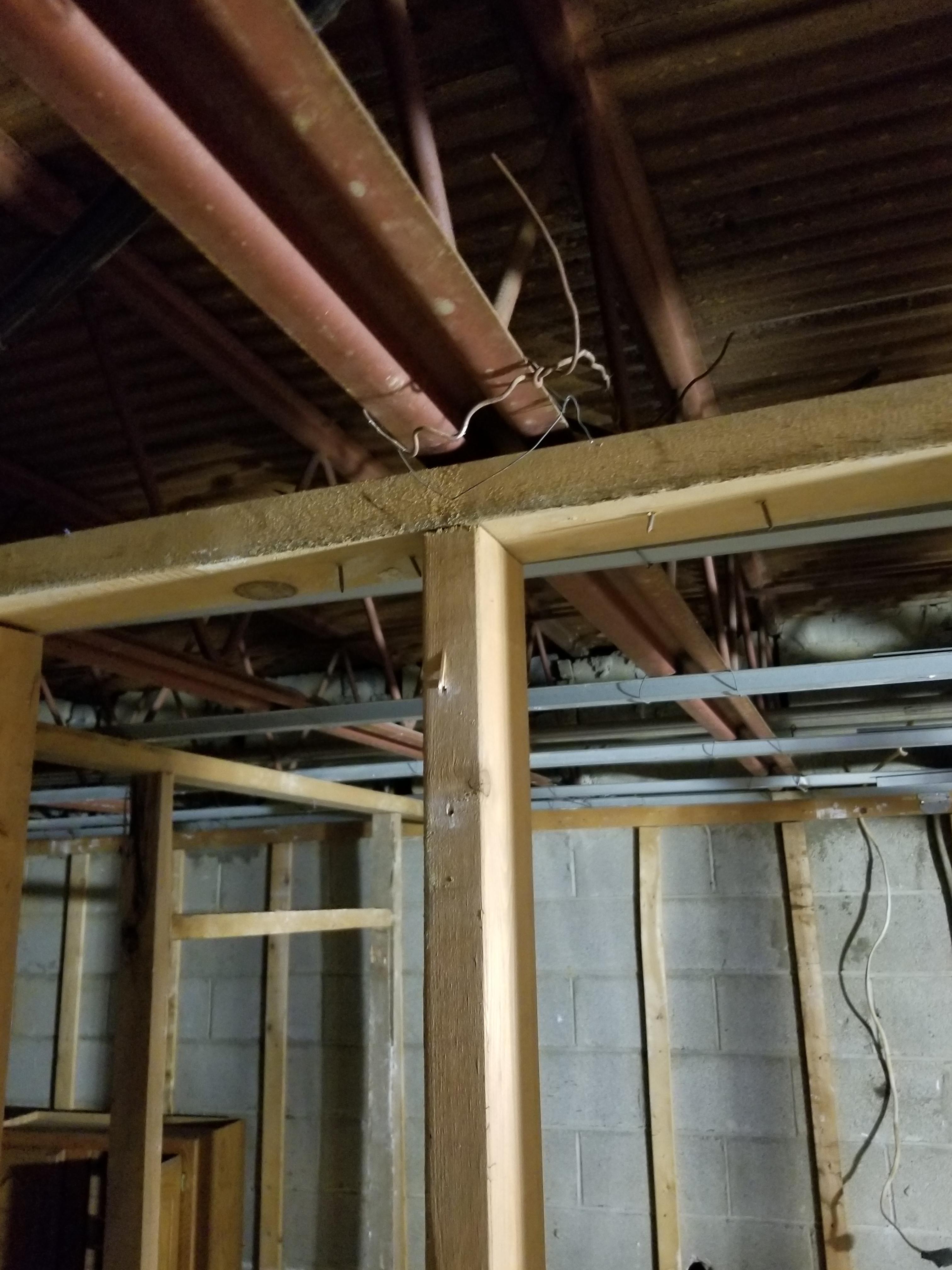 Need advice on attachment between wood framing and bar joists. r