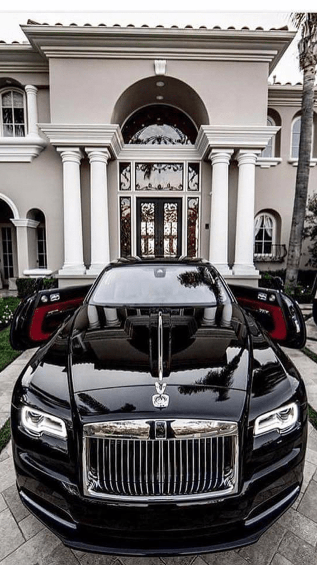 Sleek black RollsRoyce with red interior r/carporn