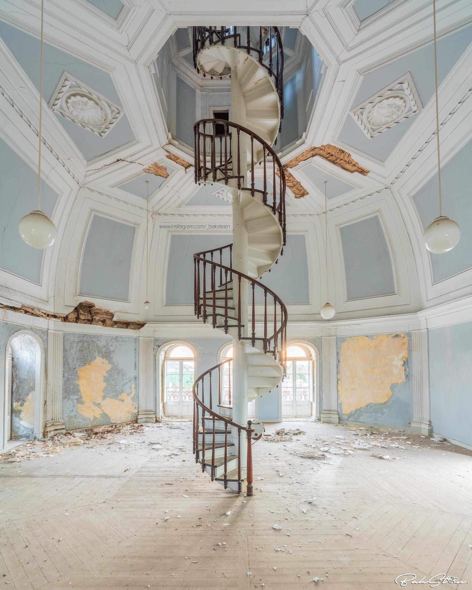 Spiral staircase to the attic of an abandoned school r/Staircase_Porn