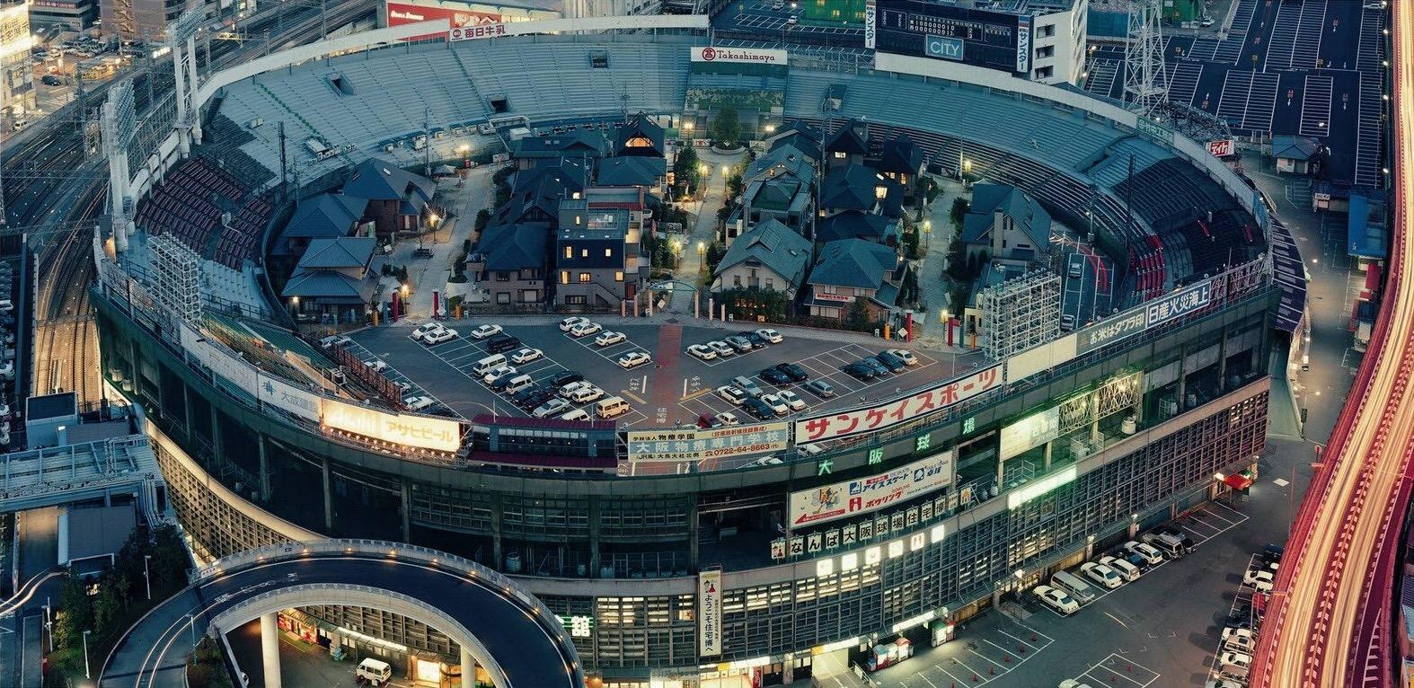 A neighbourhood inside a retired baseball stadium, Osaka, Japan. r/pics