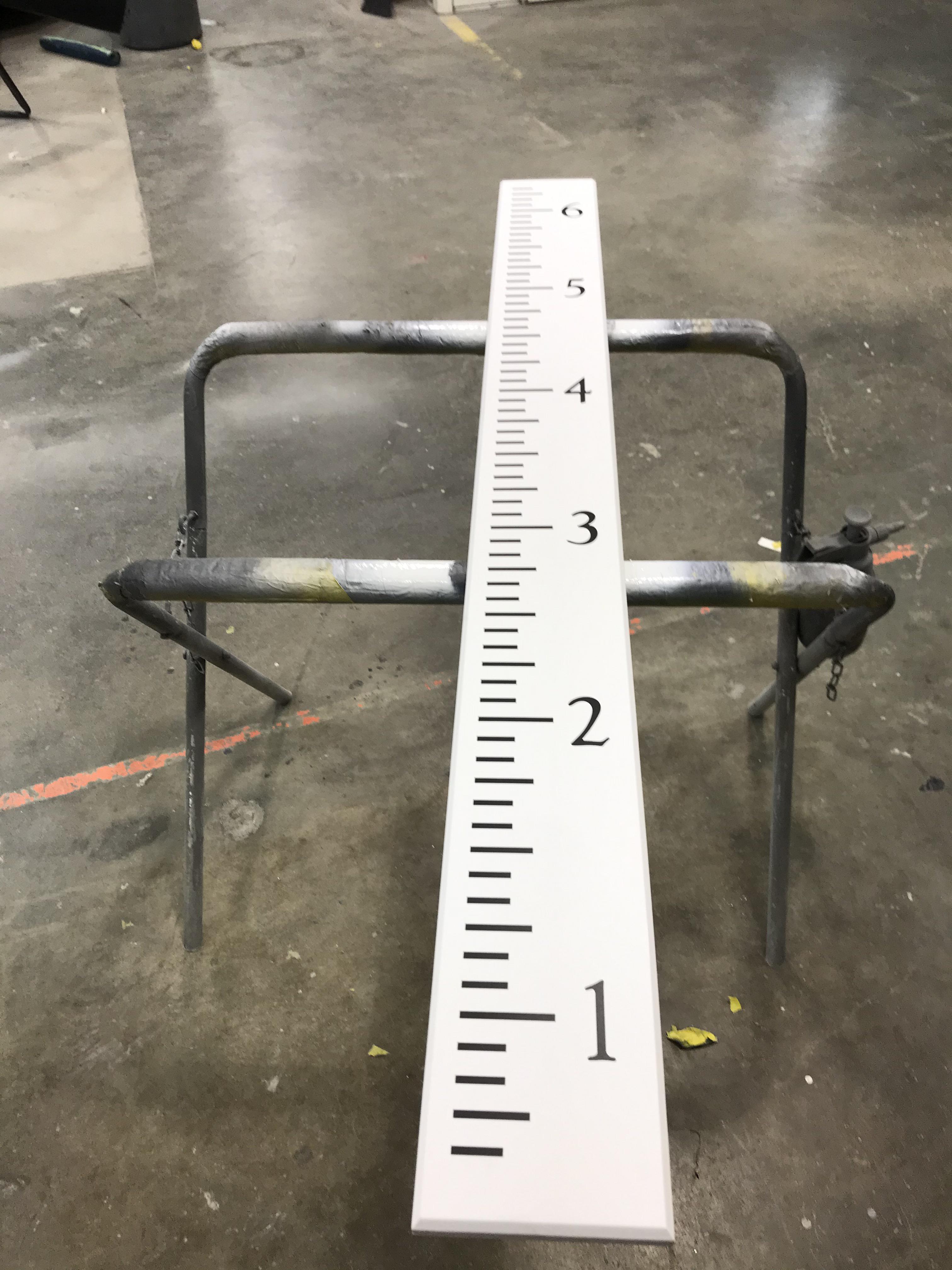 Pine wood with all automotive paint on top. Then decal and more clear