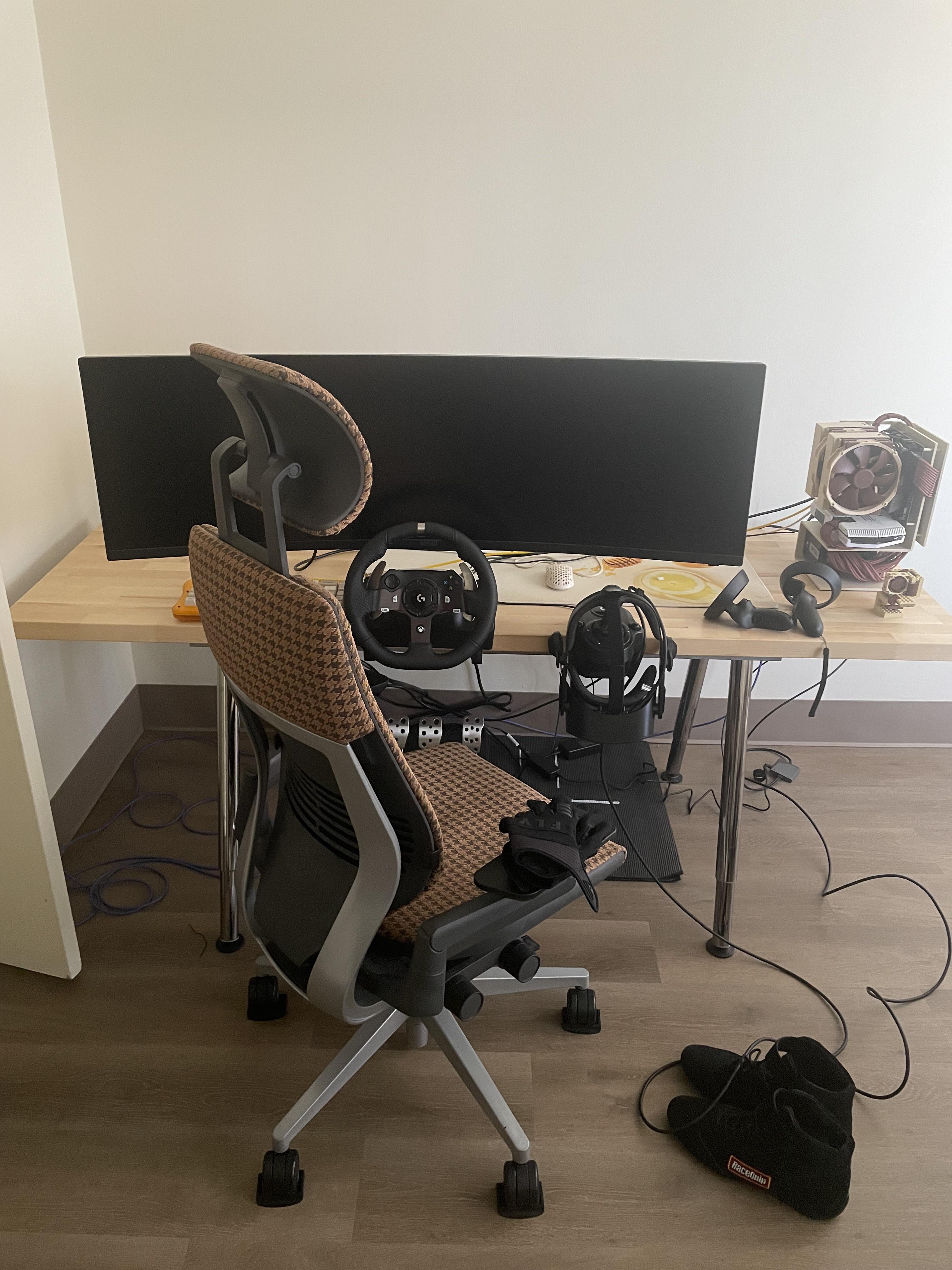 My sim rig before I upgrade to a cockpit. Desk mounted g920, 49