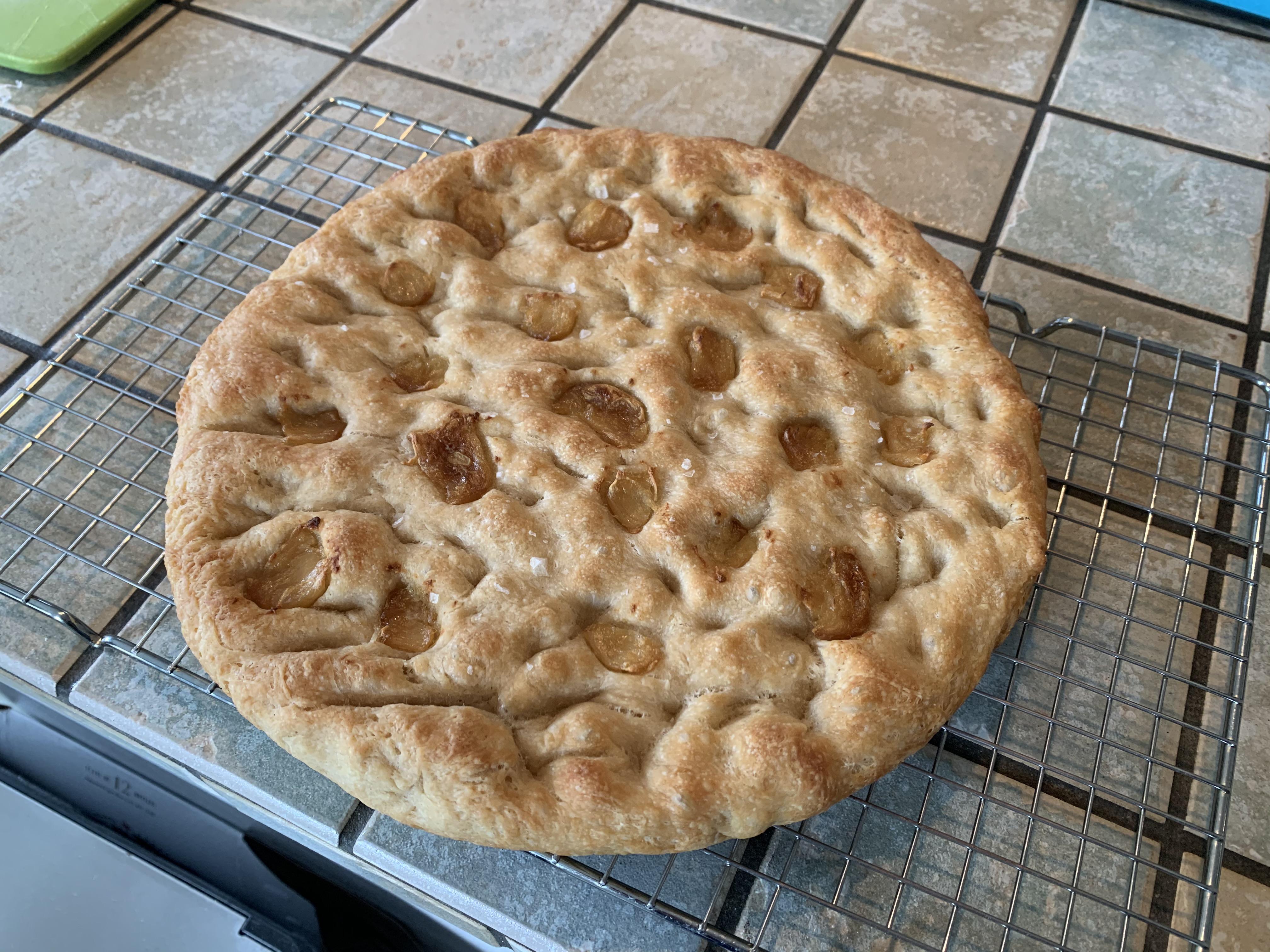 Inspired by other posters, I made Kenji’s easy roastedgarlic focaccia