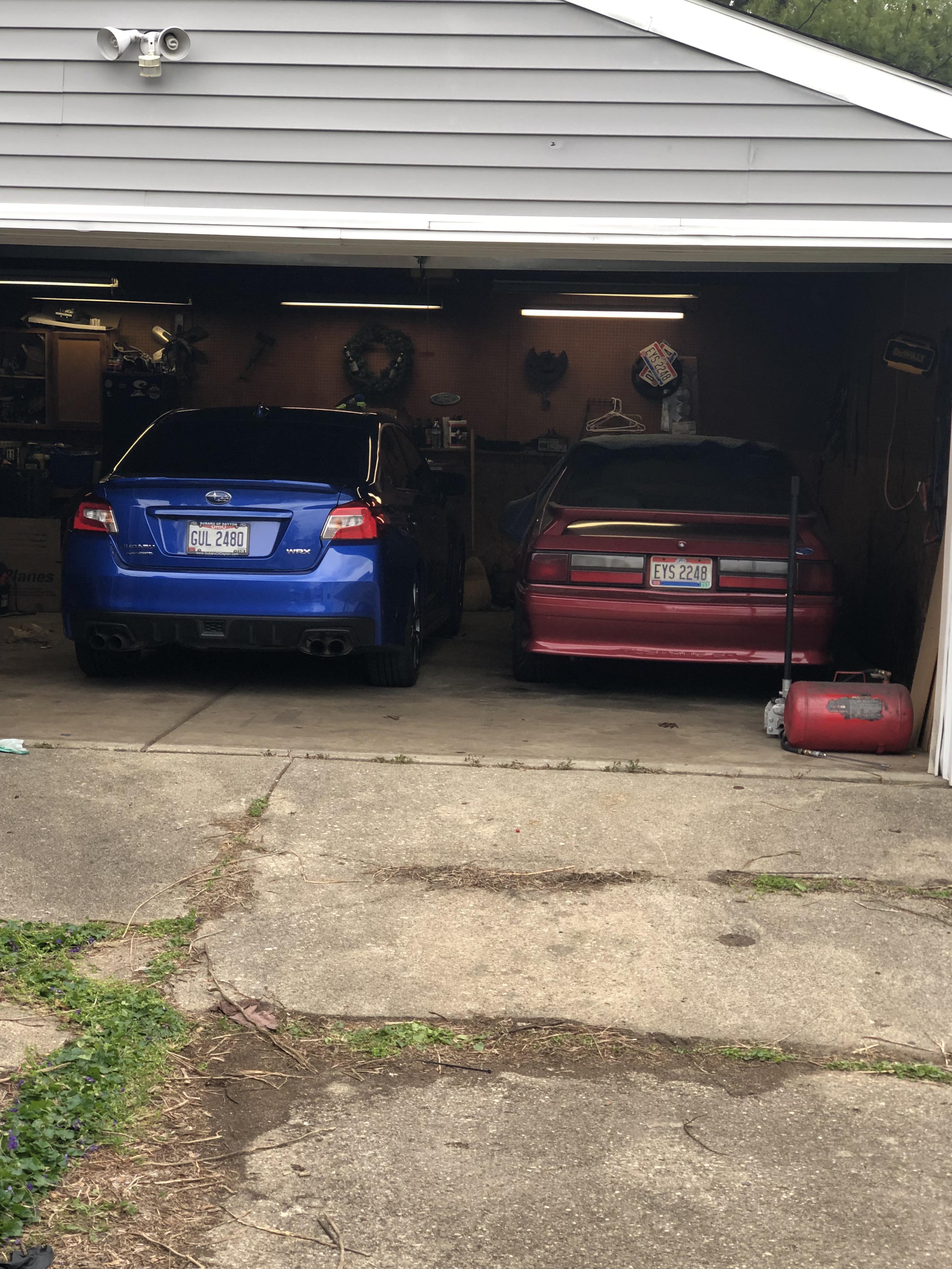 Both of my car fit in the garage now r/WRX