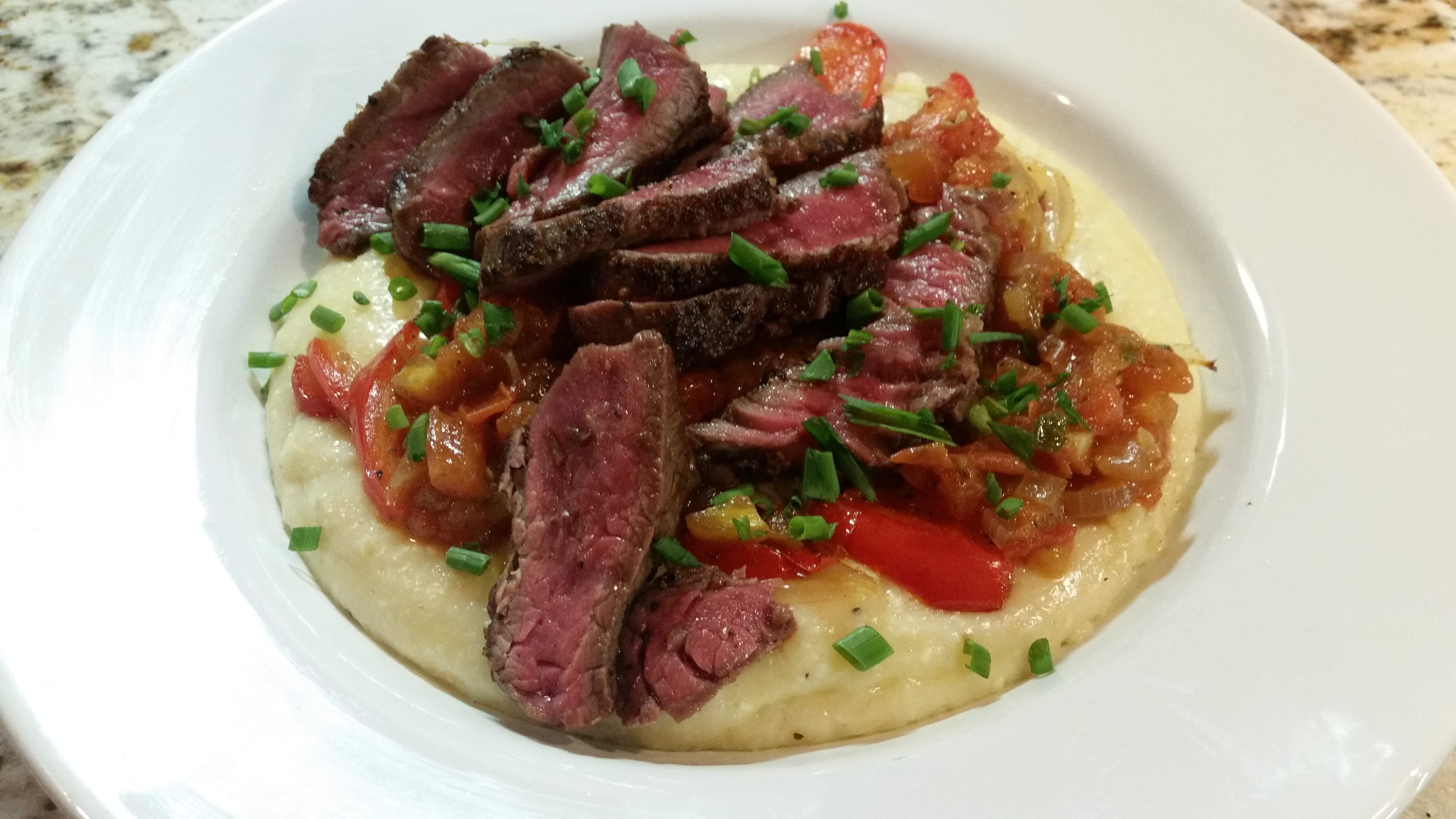 Seared Steak over Cheddar Grits with Old BayTomato Sauce r/plated