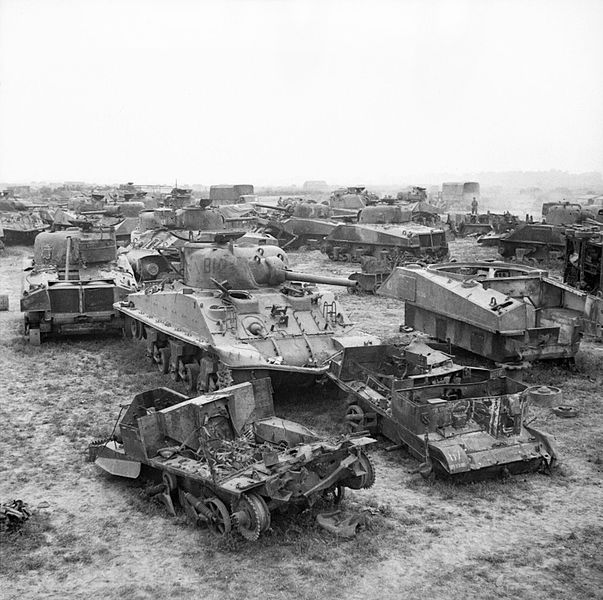 Wrecked carriers and Shermans, British Salvage Yard in Normandy, August
