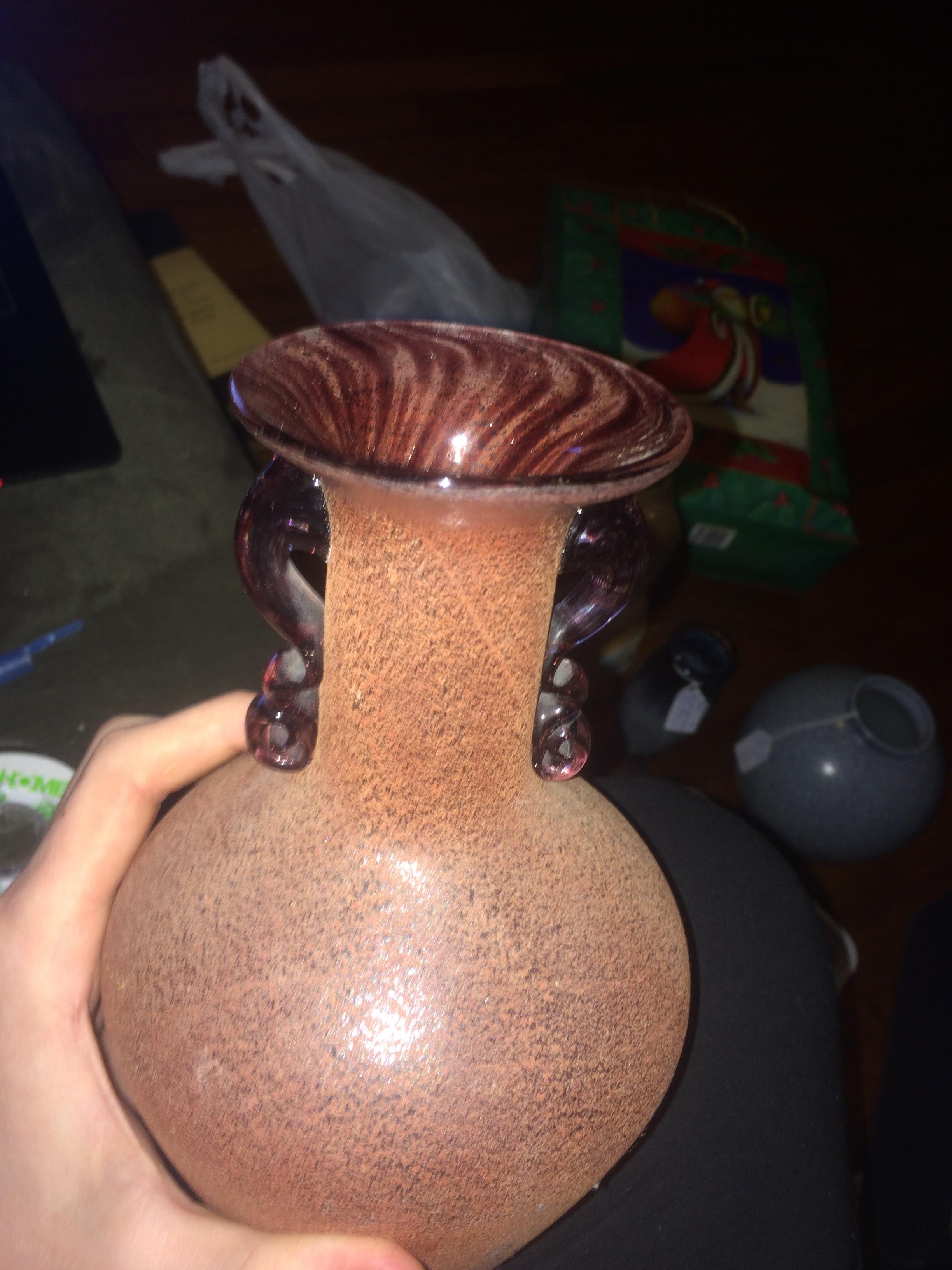 How would you describe the surface of this vase, frosted? Or another