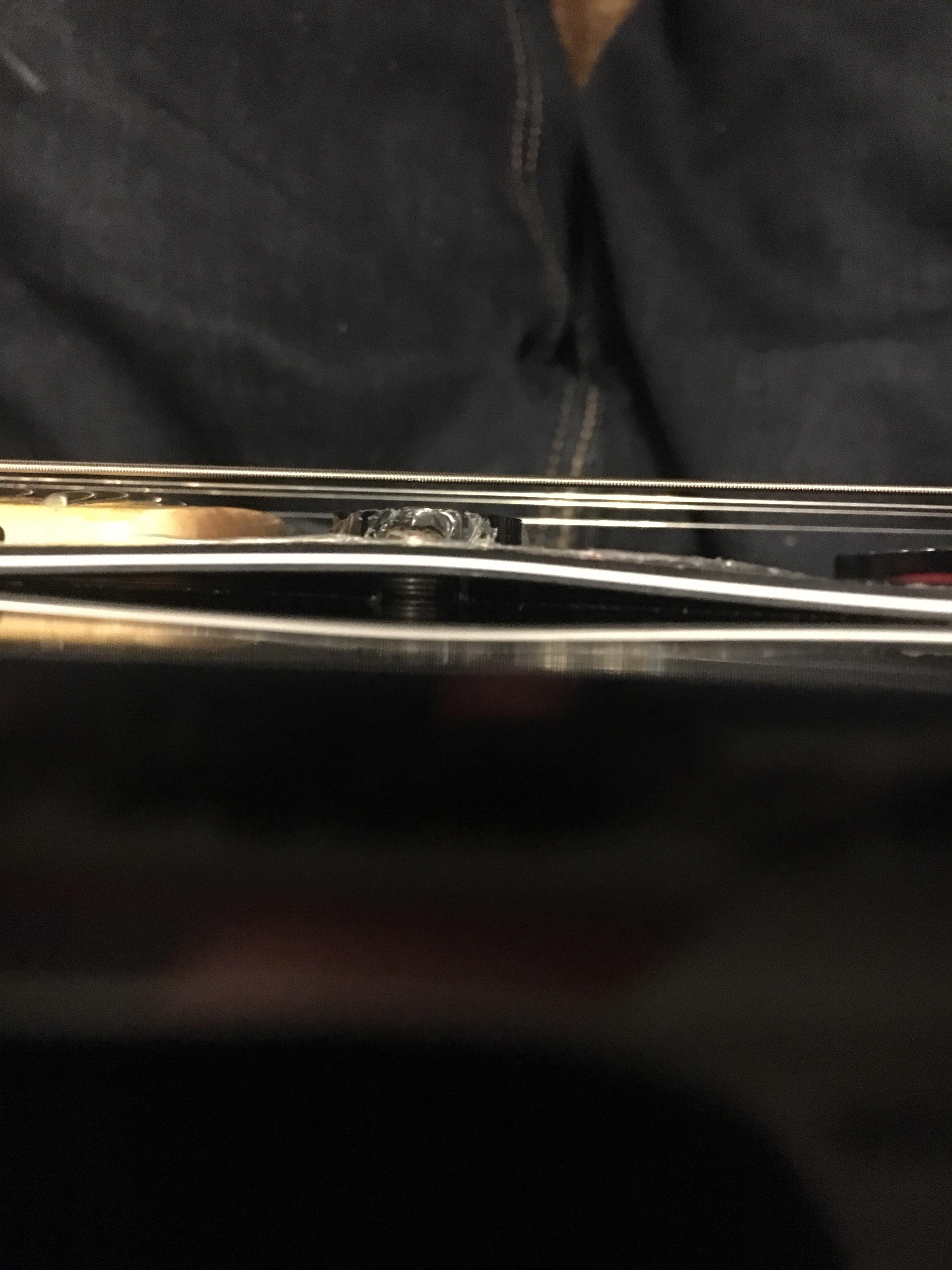 Warped Pickguard. How/can I️ fix without removing the pickguard