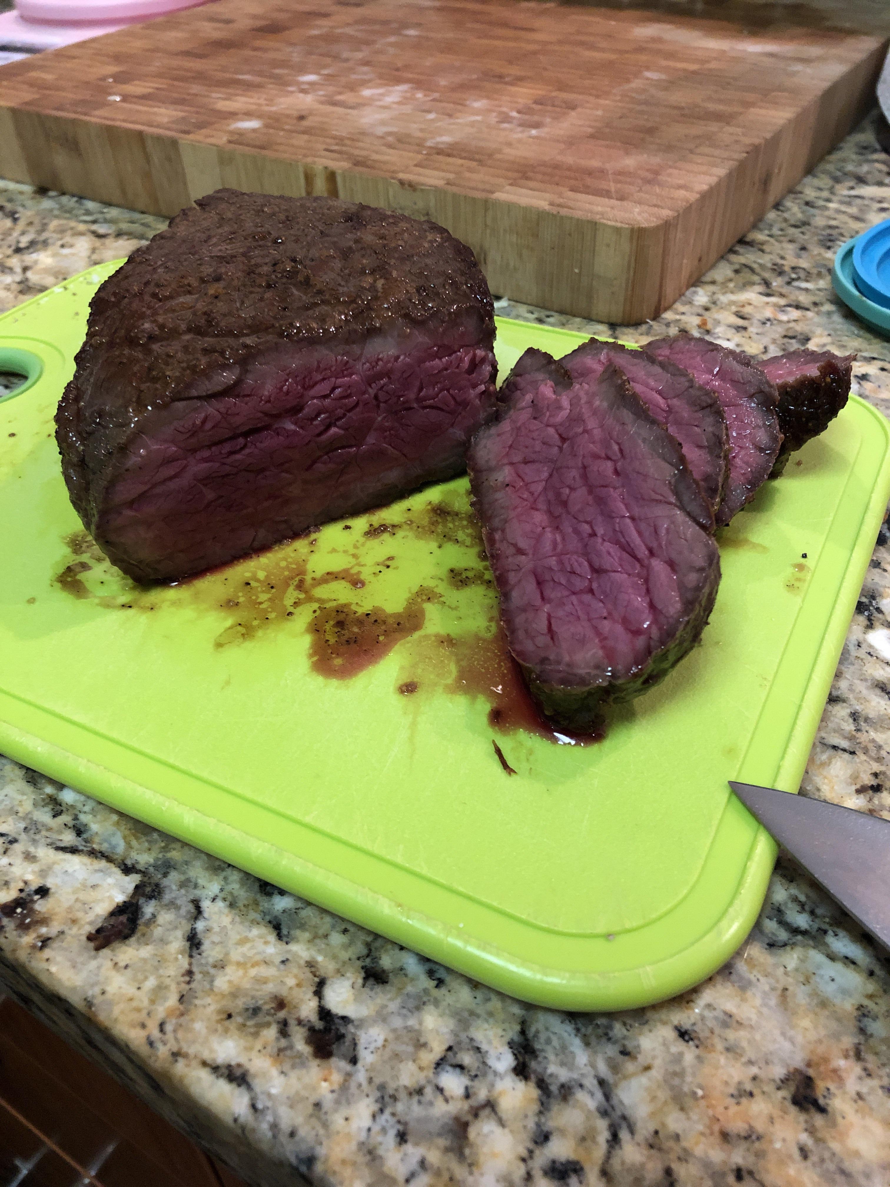 Bottom round steak heated for 2 hours at 130 then seared in my cast