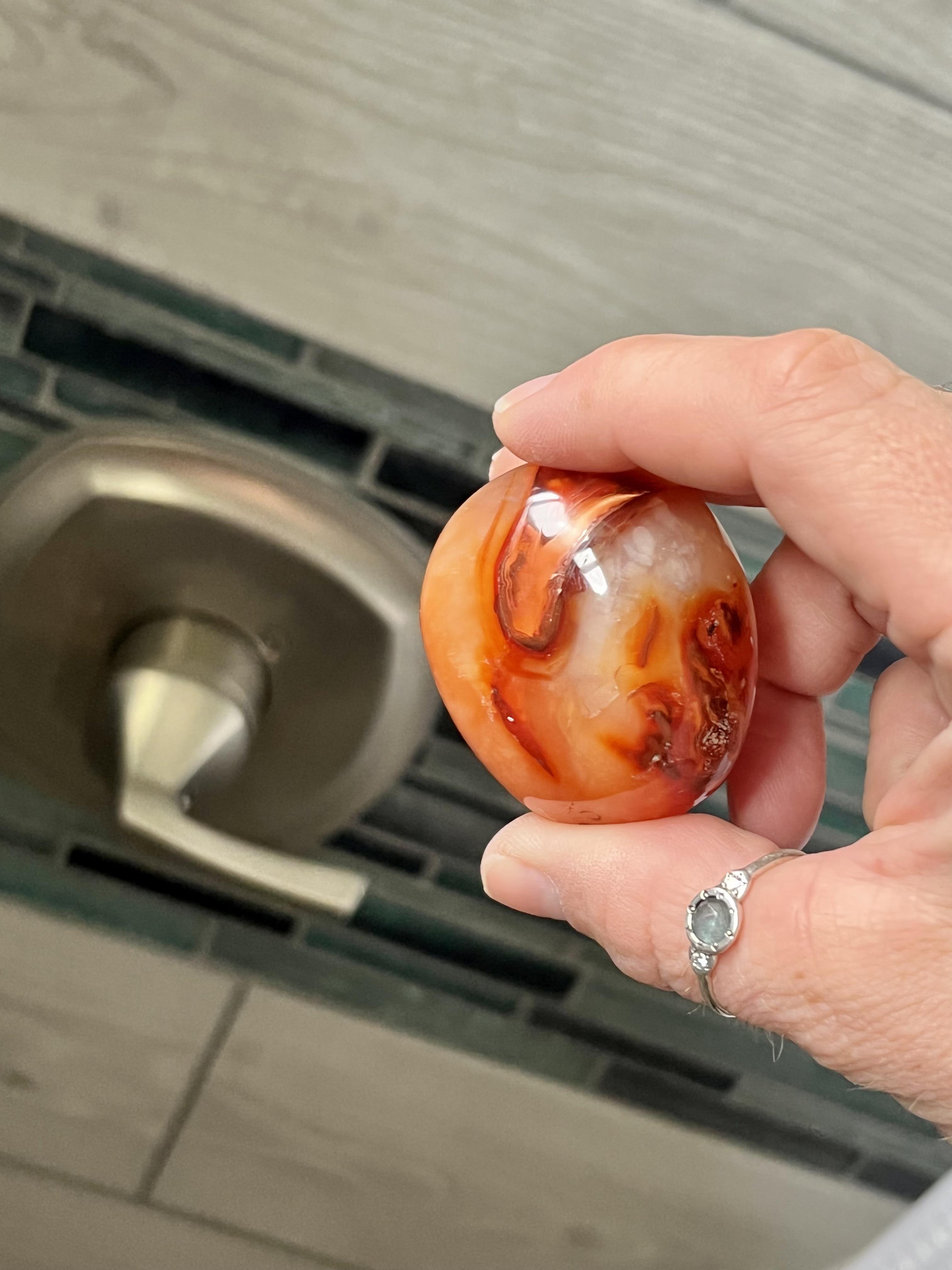 My carnelian piece I keep in my shower nook r/Crystals