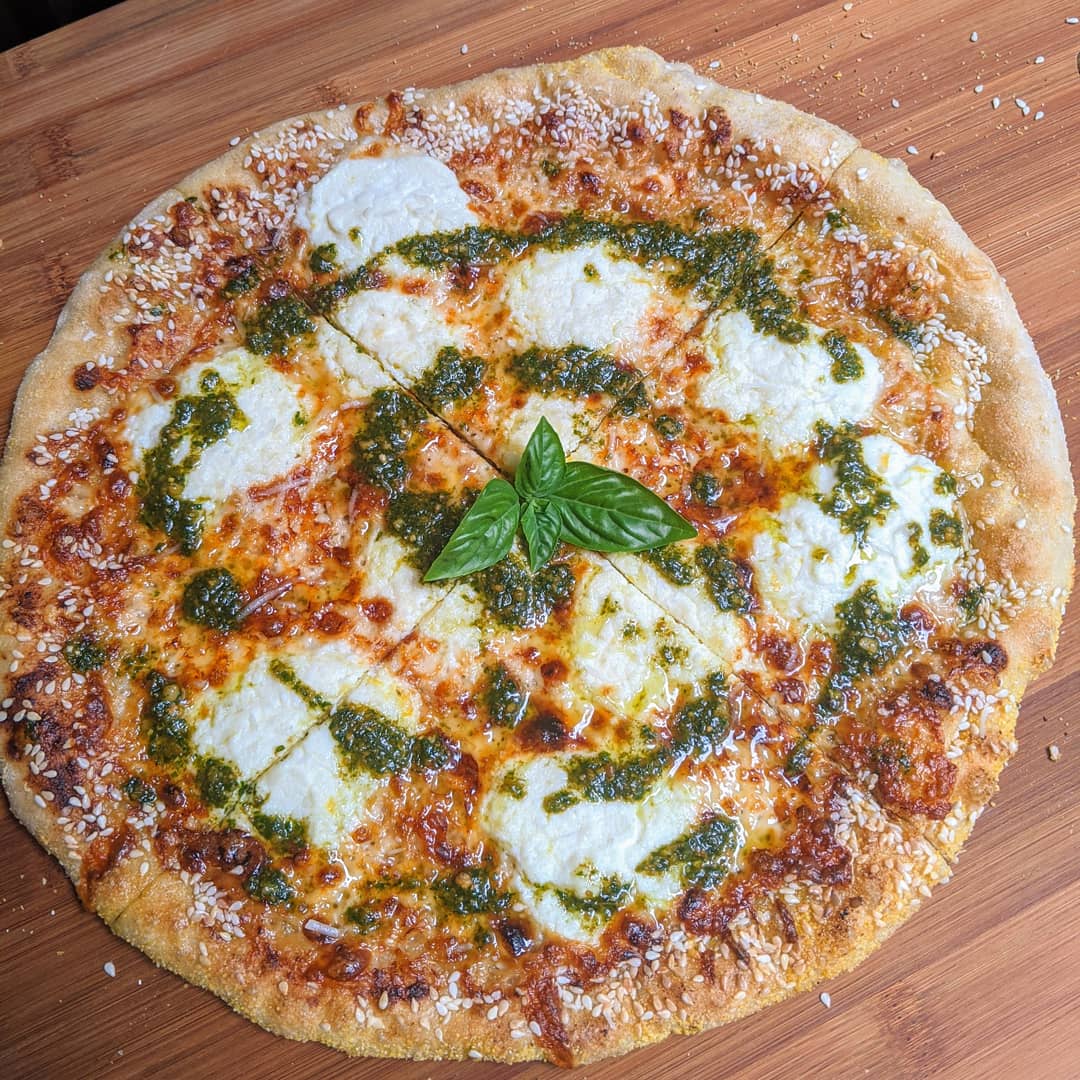 White Pie with a Pesto Drizzle and a Sesame Seed Crust! r/Pizza