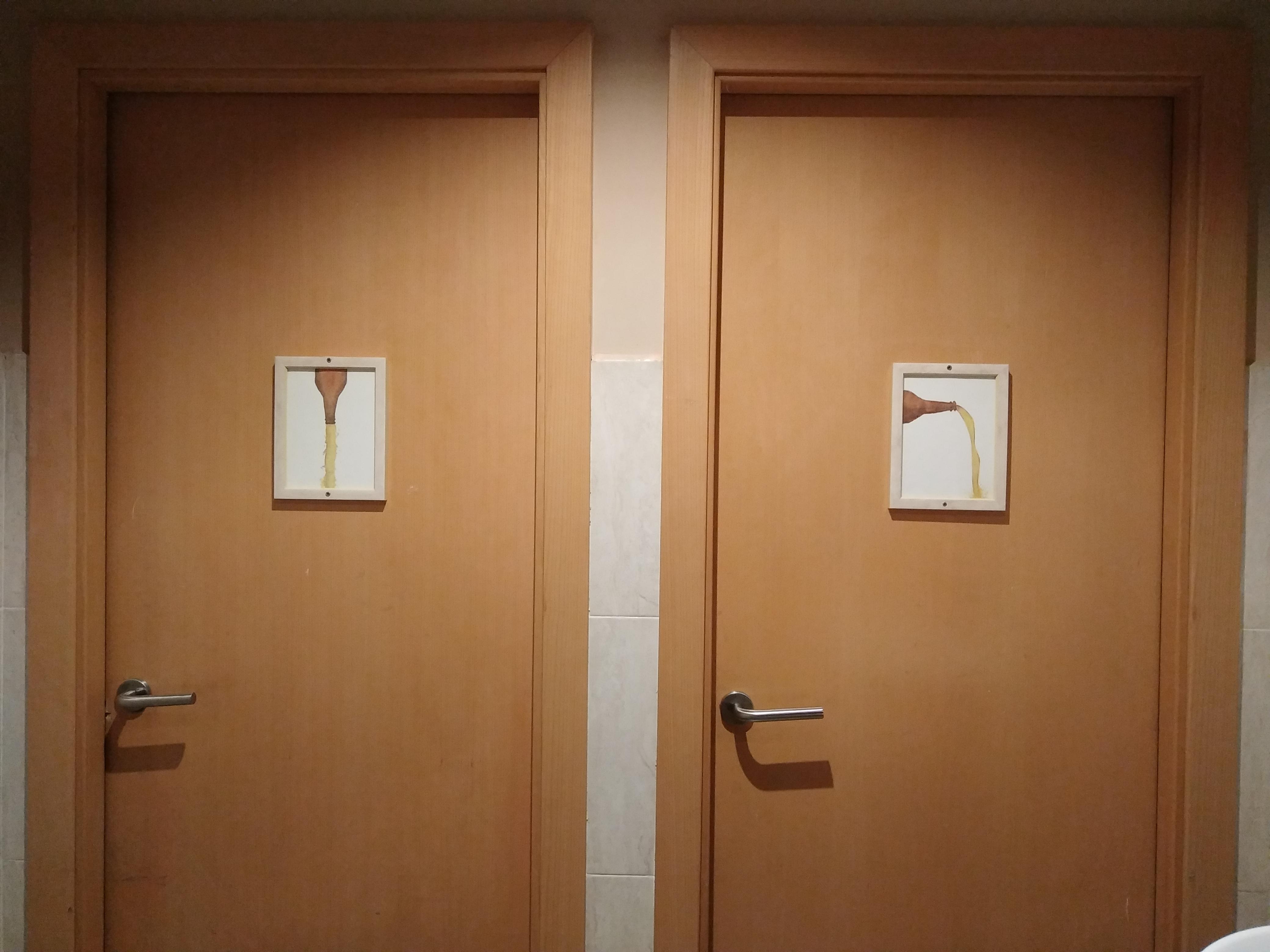 The signs on these toilet doors got me for a moment because one is