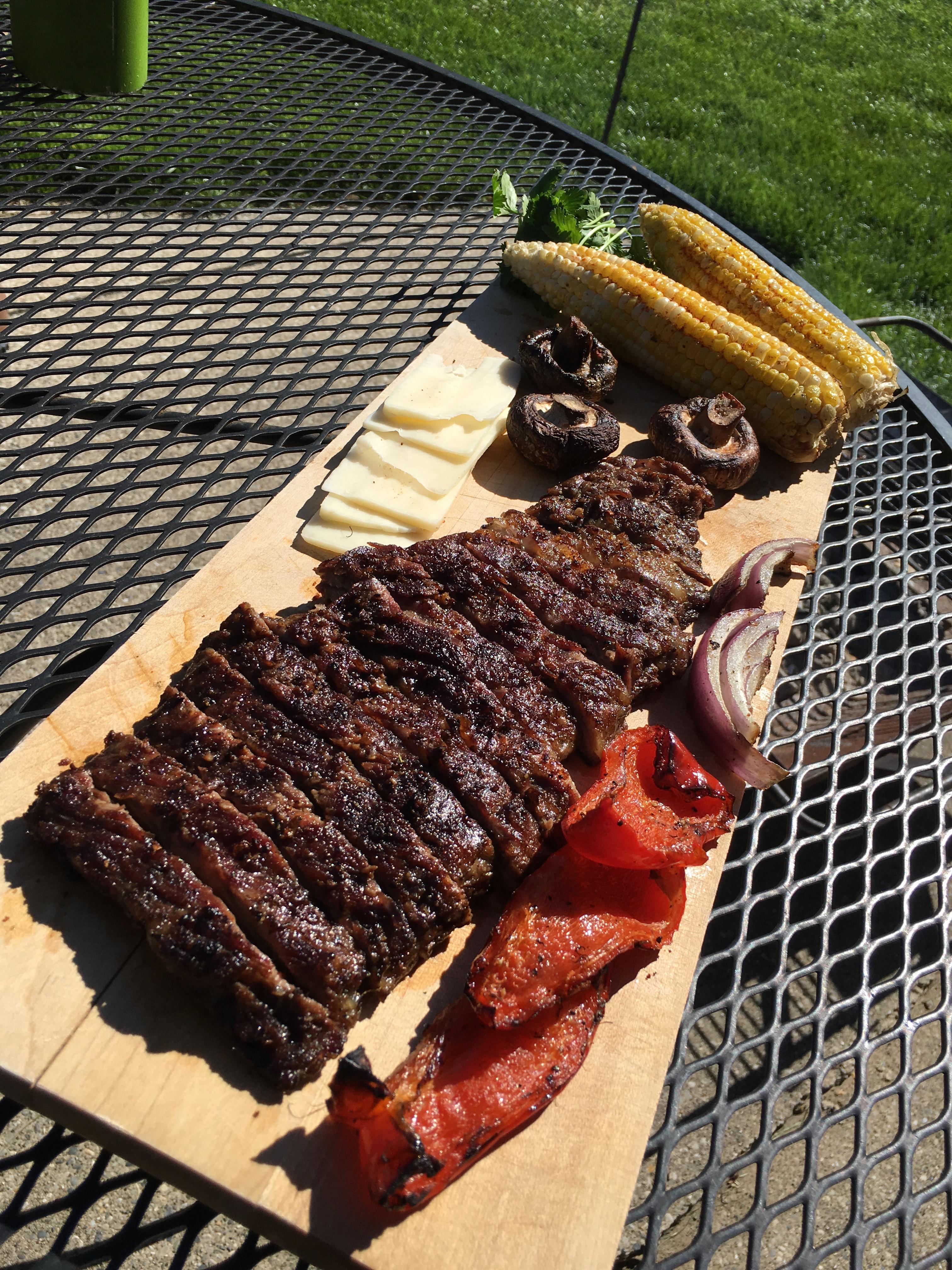 [Homemade] slow smoked skirt steak with grilled peppers, onions