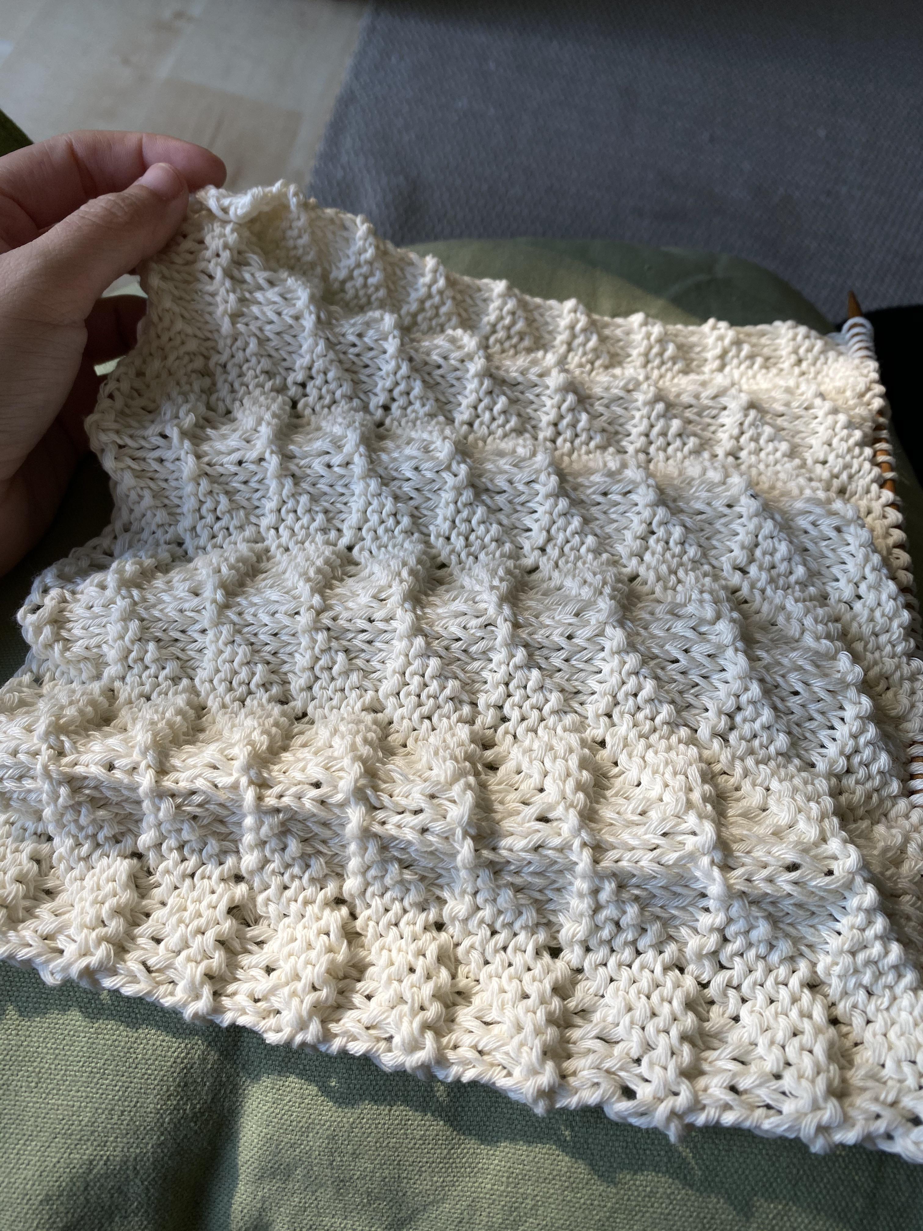 Currently knitting a set of three burp cloths from the What to Knit