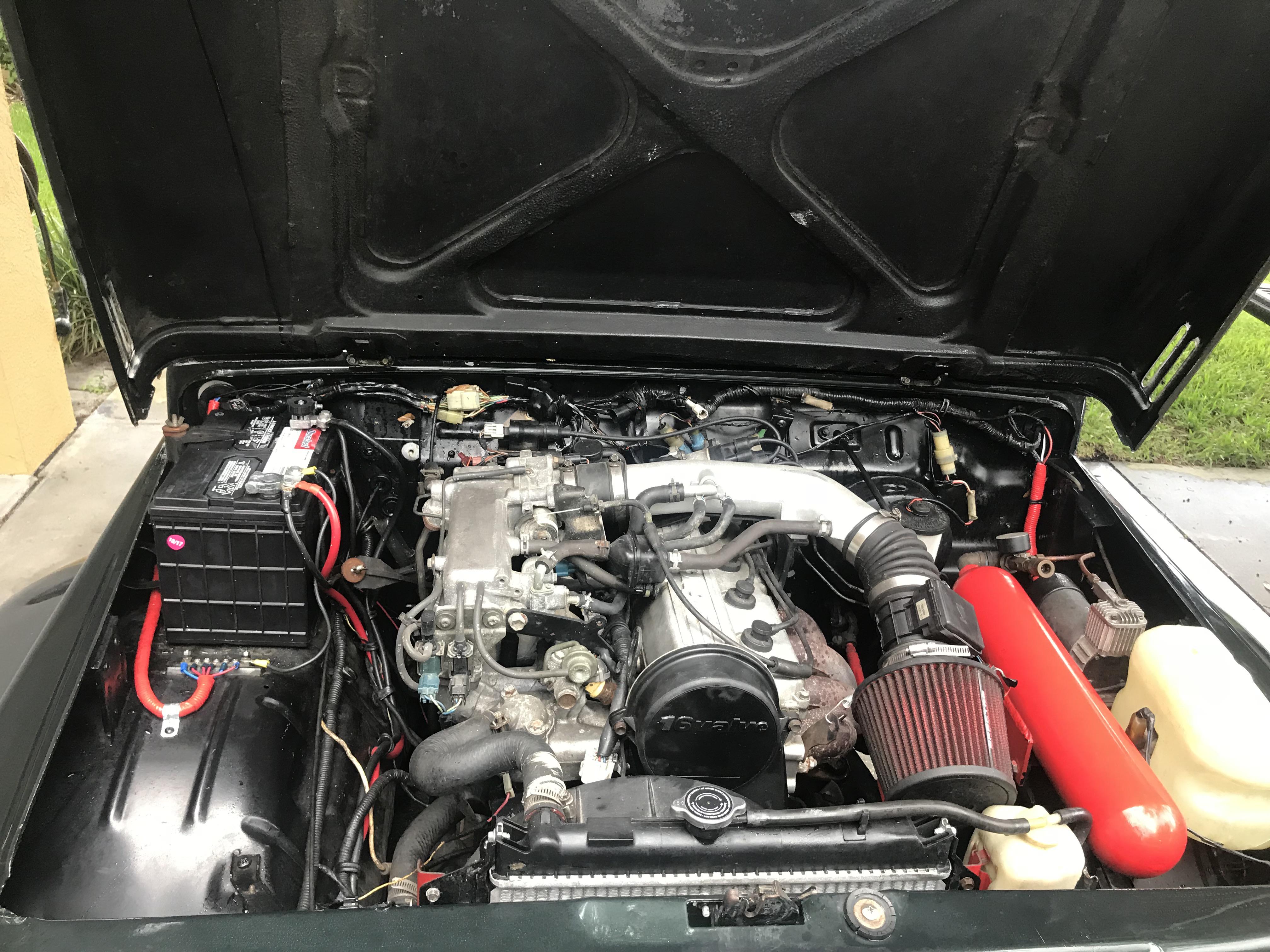 Under the hood. 1.6 L from a 96 geo tracker. Bolts right in with the