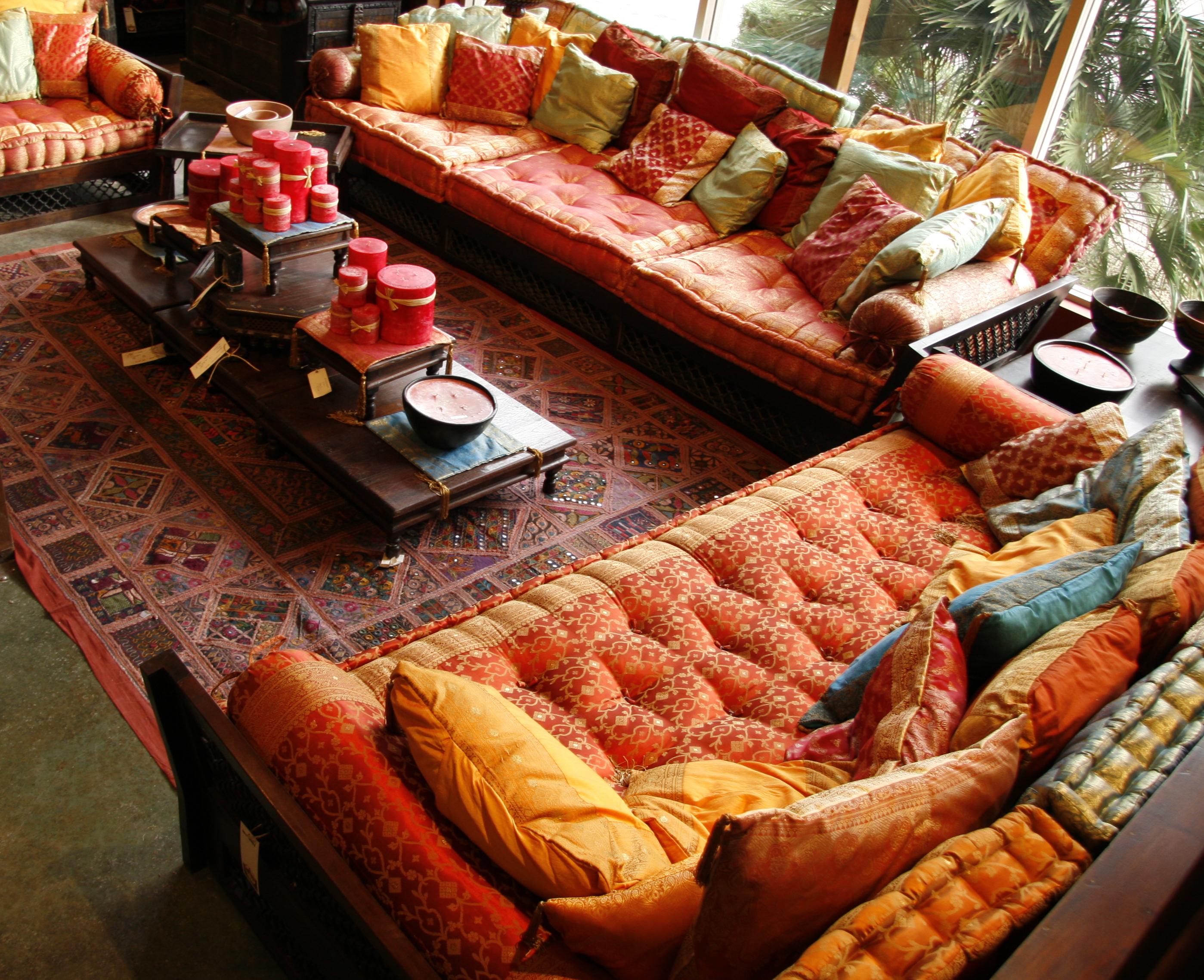 Indian sofas with kela sari mattress, cushions, low wooden table and