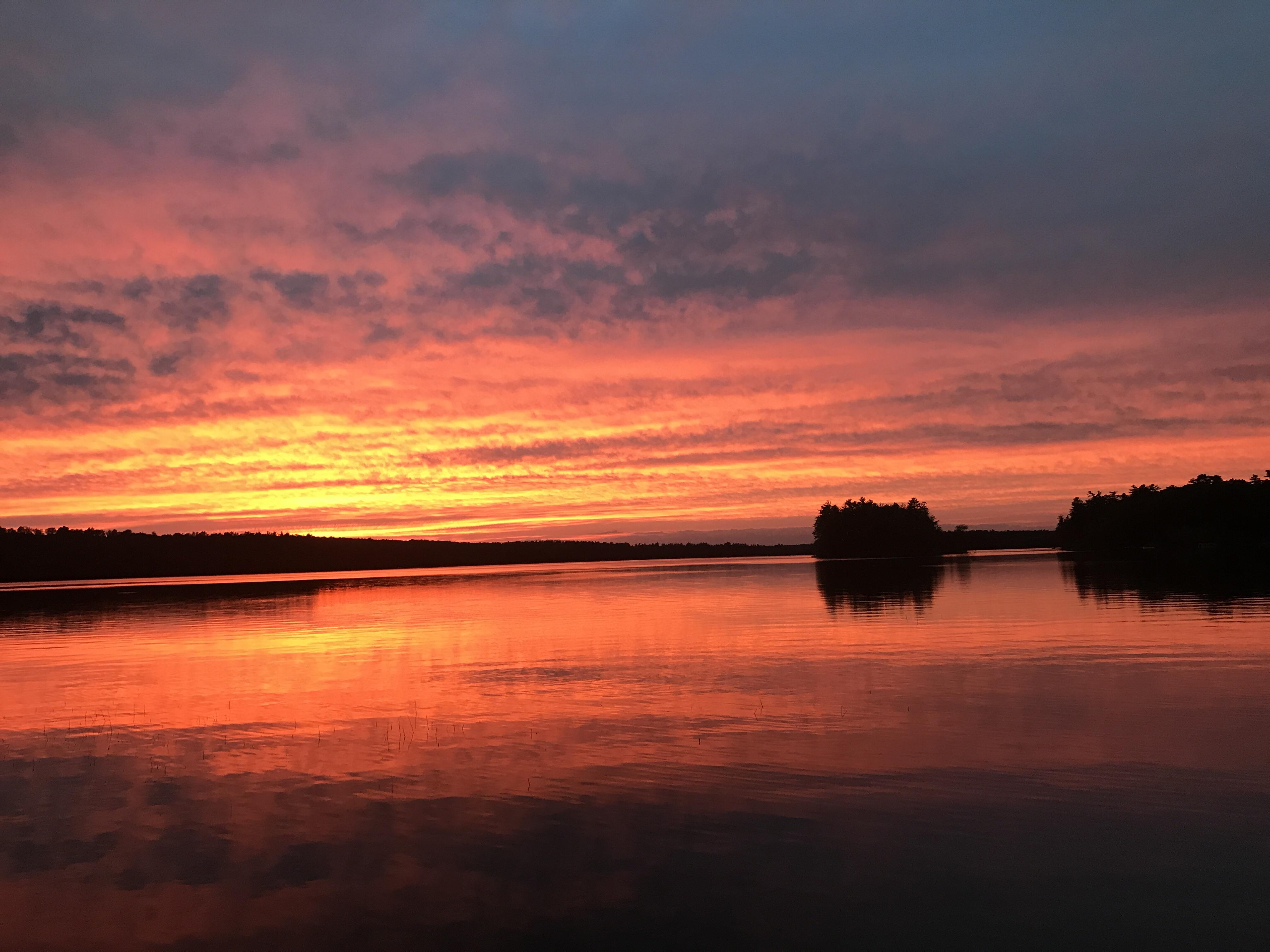 Sunset over Tripp lake in Poland Maine. r/Maine