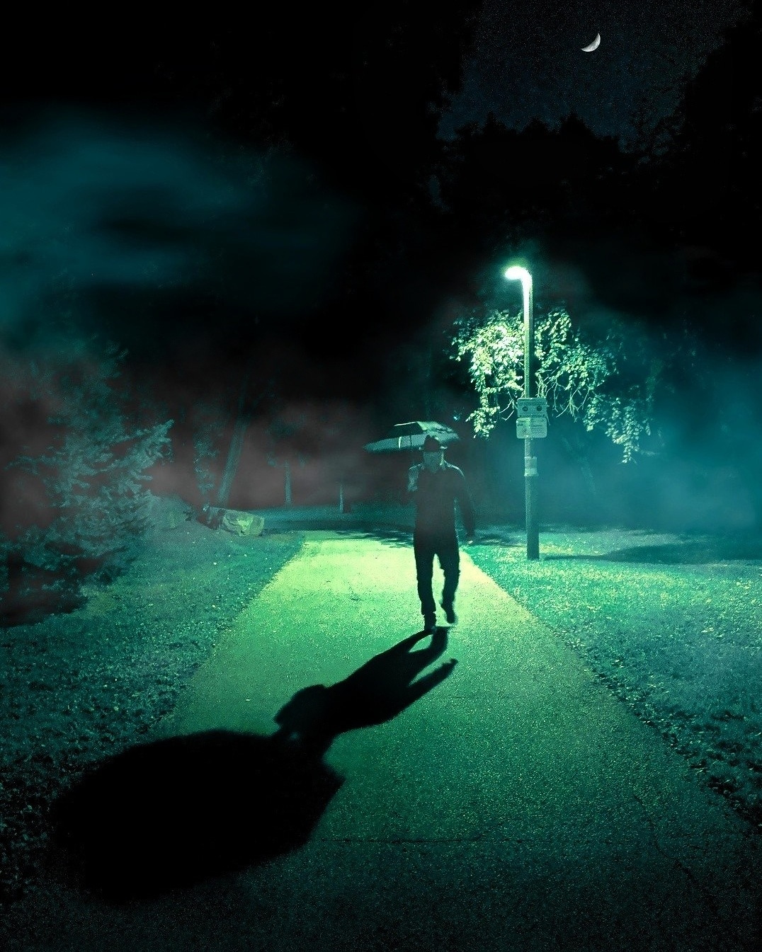 Man walking through a park at night r/AmateurPhotography
